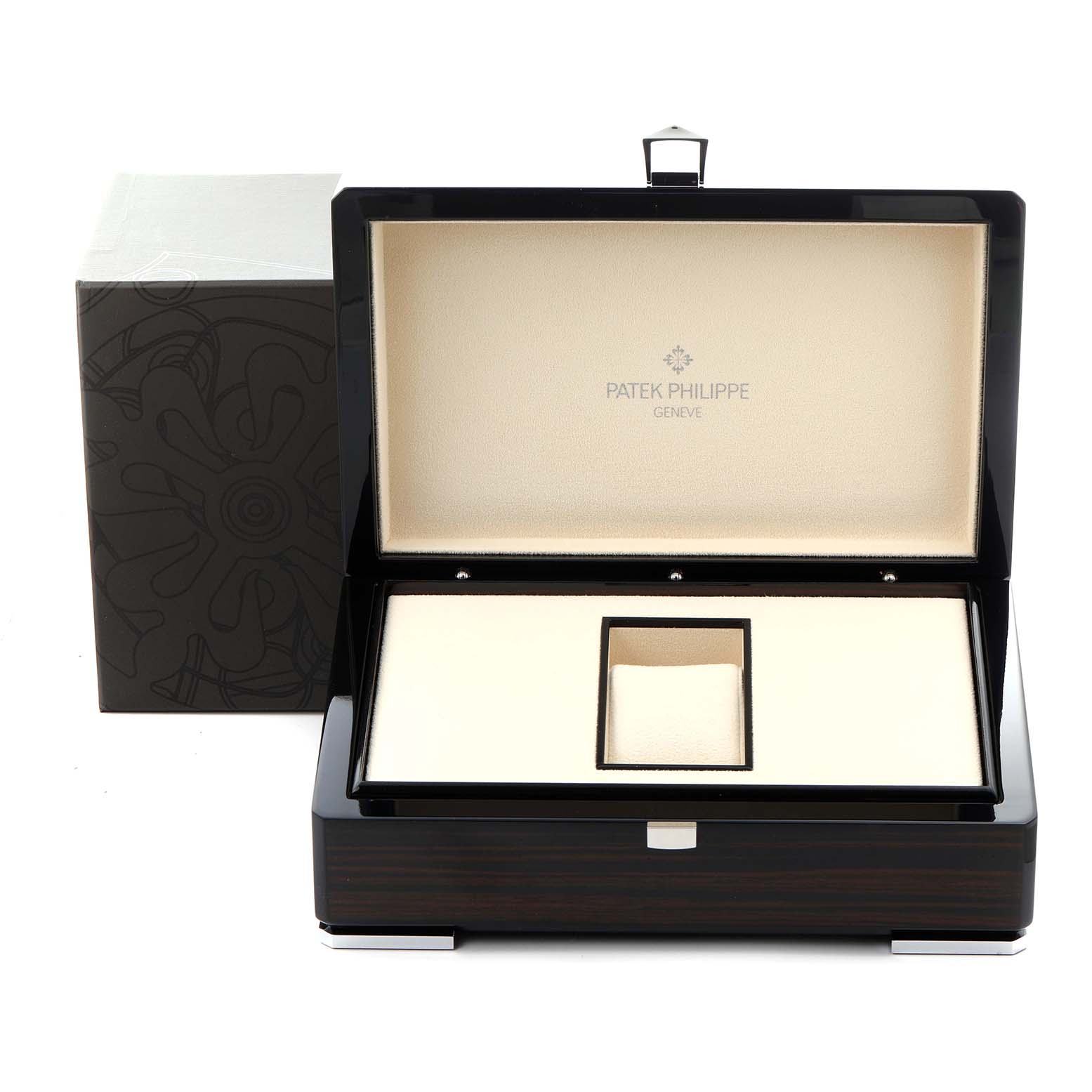 The image shows an open Patek Philippe Calatrava 6000G-012 Men's White Gold Blue Dial 6000G-012 Men's White Gold Blue Dial watch box at a straight-on angle, showcasing its interior design.