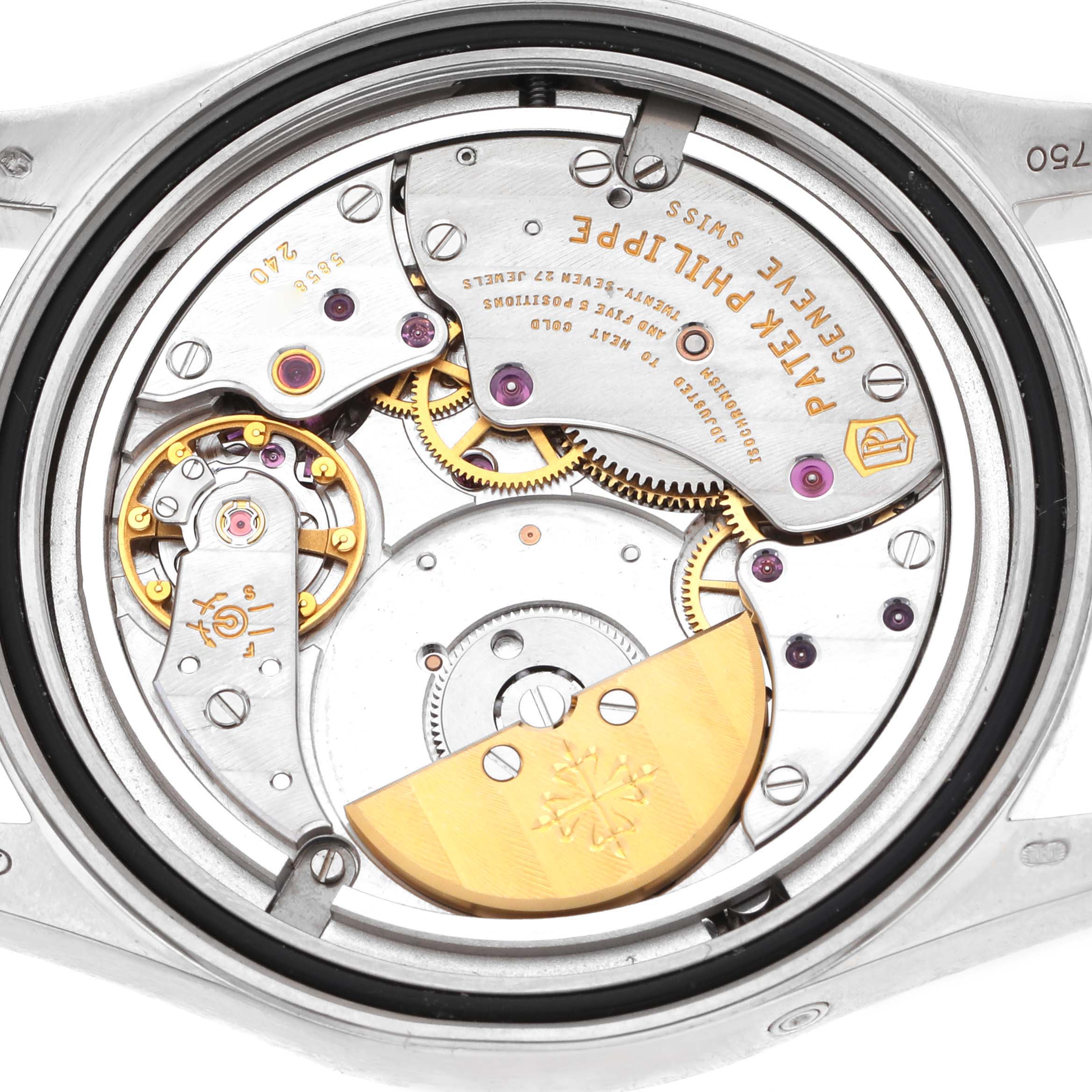 The image shows the intricate movement of a Patek Philippe Calatrava 6000G-012 Men's White Gold Blue Dial 6000G-012 Men's White Gold Blue Dial watch from a top-down angle.