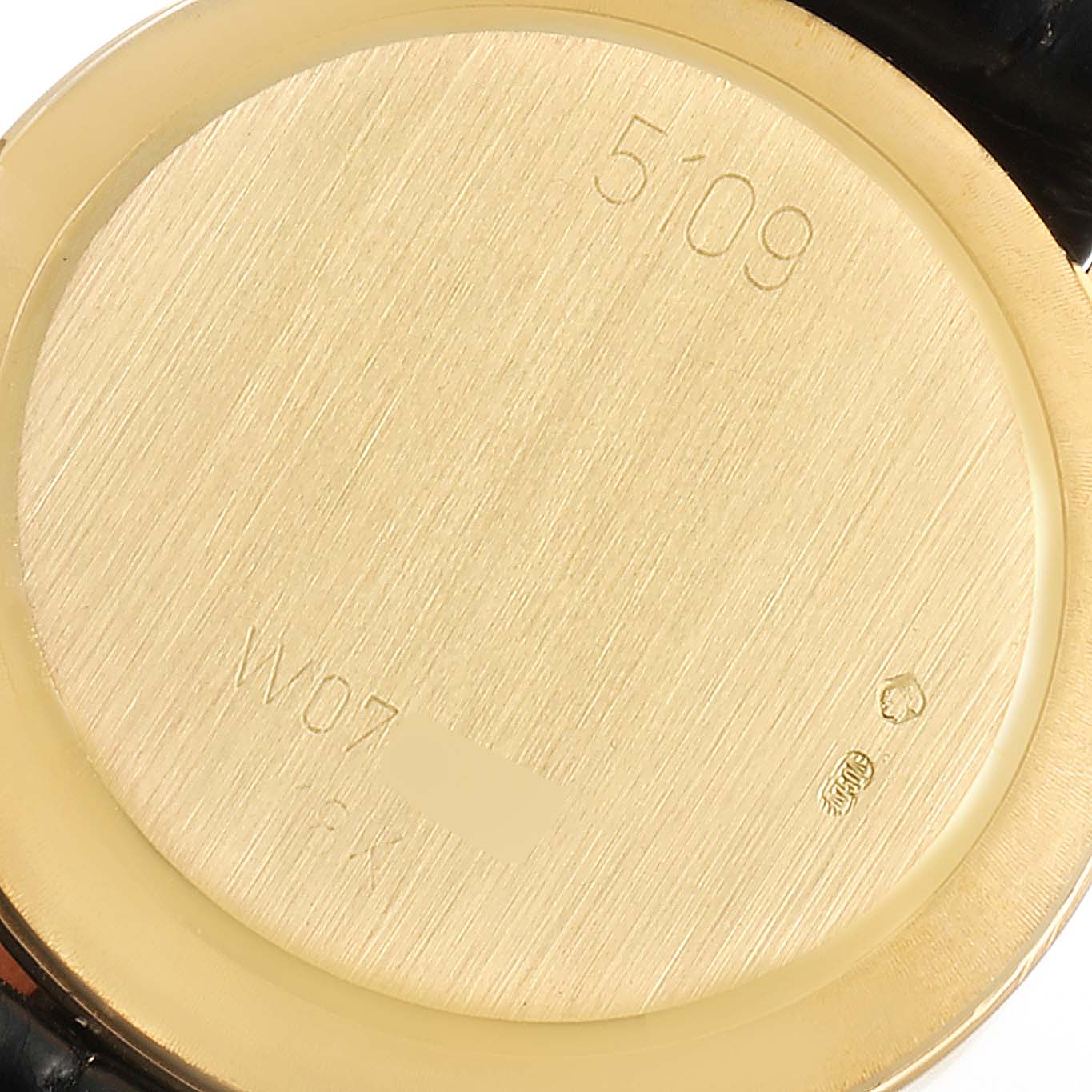 The image shows the back case of a Rolex Cellini 5109 Women's Yellow Gold Mother of Pearl Dial 5109 Women's Yellow Gold Mother of Pearl Dial watch, highlighting engravings and the gold material.