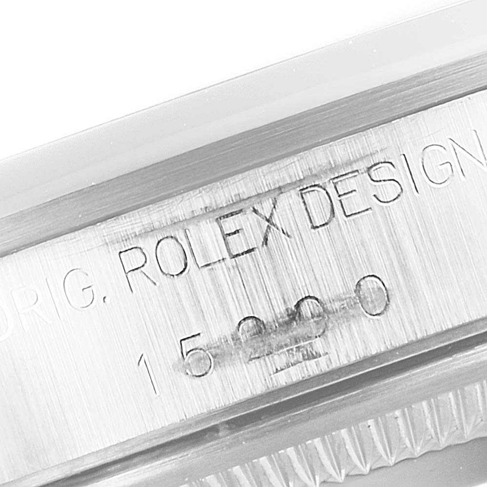 The image shows a close-up of the side engraving with "ORIG. ROLEX DESIGN" on a Date model Rolex watch.