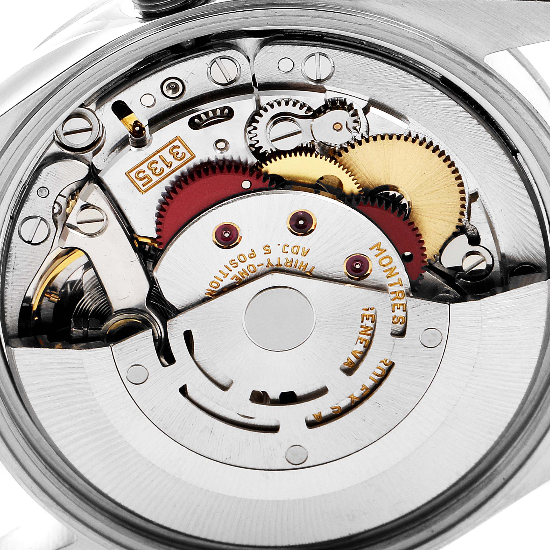 The image shows a close-up of the internal mechanism of a Rolex Date 15200 Men's Stainless Steel Blue Dial 15200 Men's Stainless Steel Blue Dial model watch, highlighting gears and movement parts.