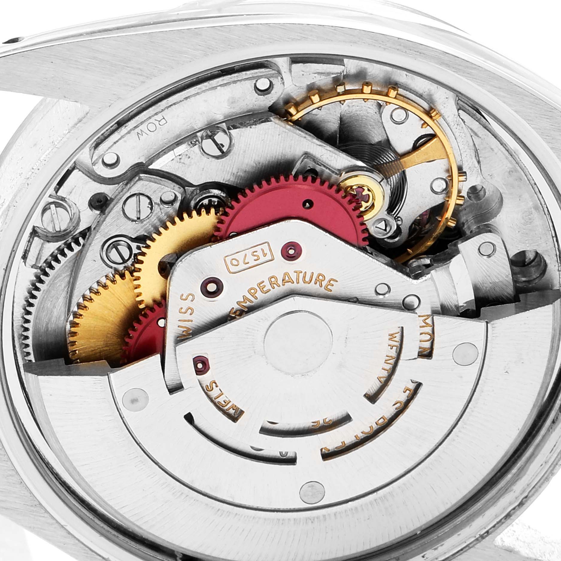 This image shows the inner mechanism of a Vintage Collection Rolex watch, focusing on the intricate gears and components.
