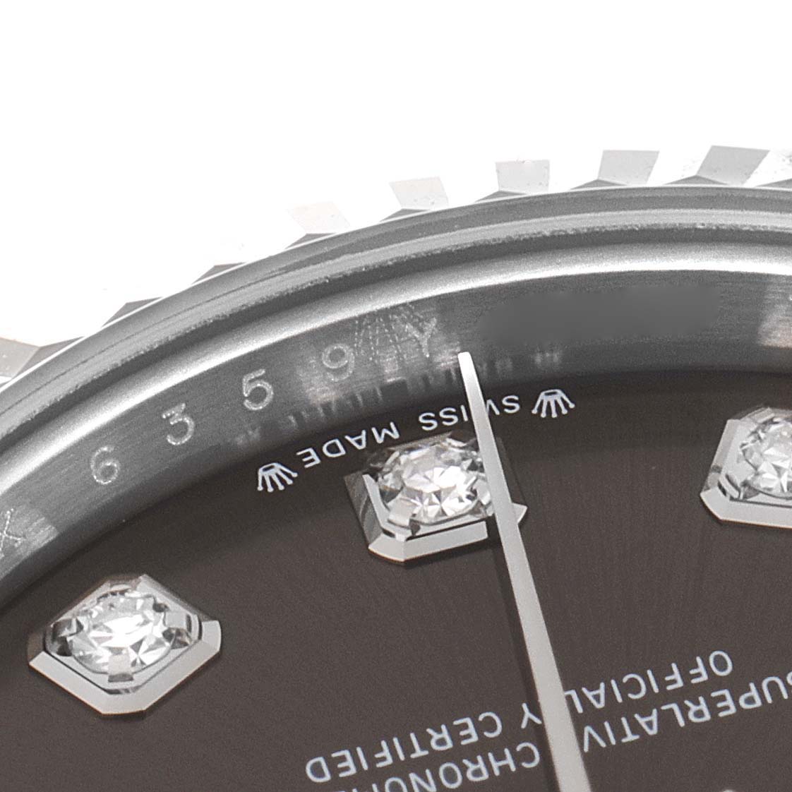 This close-up image of the Rolex Datejust 279174 Women's Stainless Steel Grey Dial 279174 Women's Stainless Steel Grey Dial watch shows a partial view of the dial, bezel, and diamond hour markers.