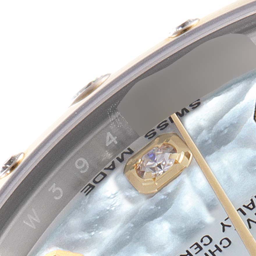 This close-up angle shows the dial and part of the bezel of a mid-size Rolex watch.
