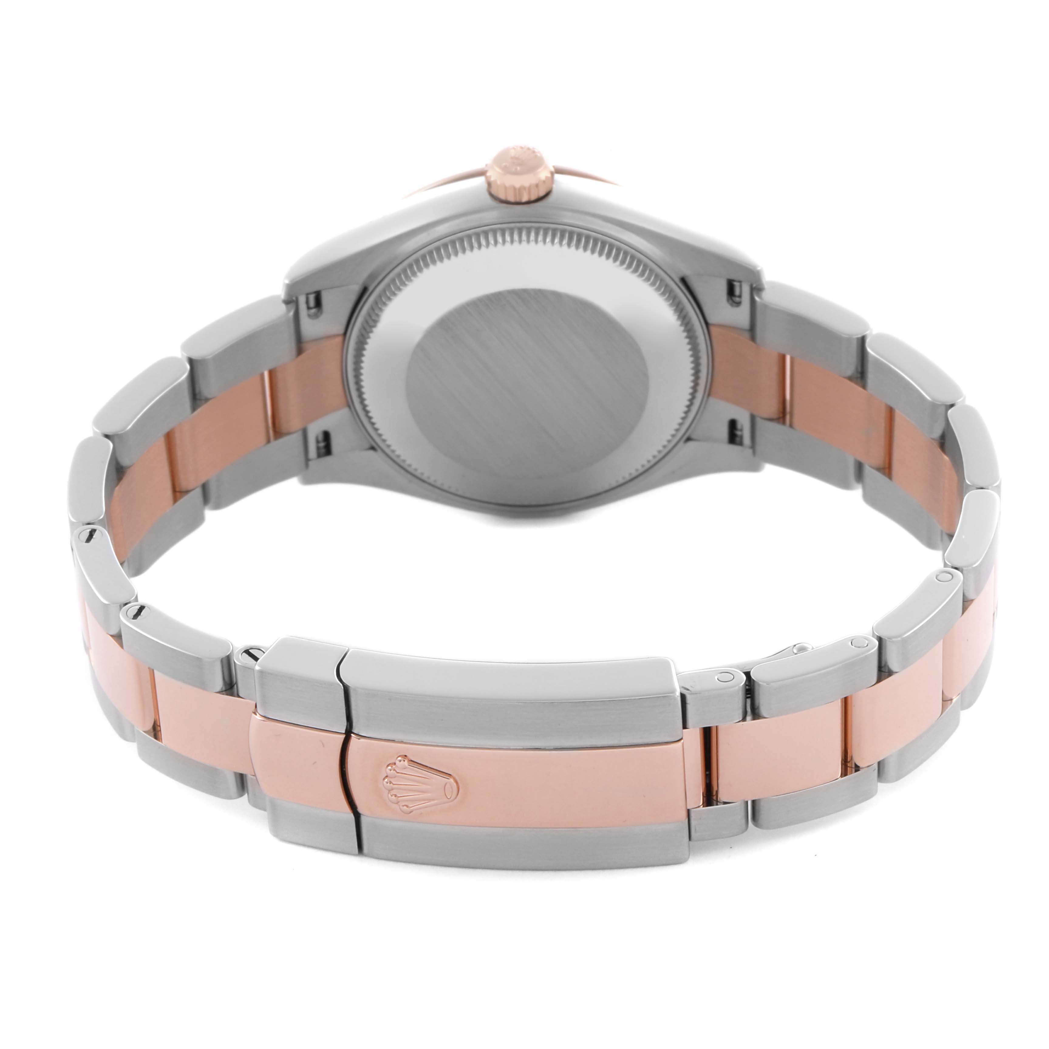 The Rolex Mid-Size 278271 Women's Steel and Gold (two tone) Grey Dial 278271 Women's Steel and Gold (two tone) Grey Dial watch is shown from the back, highlighting the case back, crown, and two-tone bracelet with the clasp.