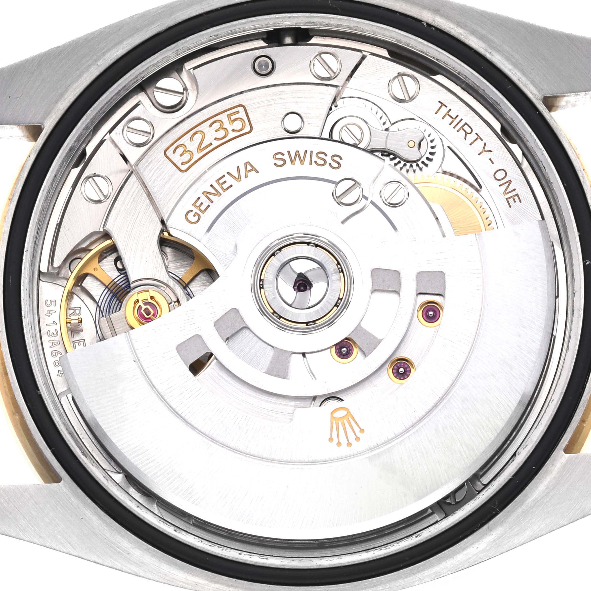 This image shows a close-up of the movement inside a Rolex Datejust 126283RBR Men's Steel and Gold (two tone) Champagne Dial 126283RBR Men's Steel and Gold (two tone) Champagne Dial watch, focusing on the intricate gears and rotor.
