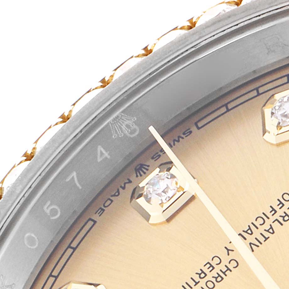 The image shows a close-up of the dial and bezel of a Rolex Datejust 126283RBR Men's Steel and Gold (two tone) Champagne Dial 126283RBR Men's Steel and Gold (two tone) Champagne Dial, highlighting diamond markers and text detailing.