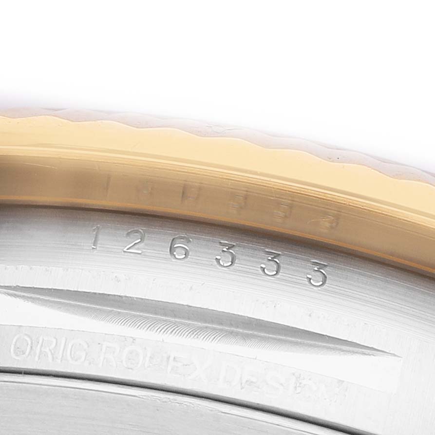 The image shows a close-up of the side of the bezel and engraved serial number on the Rolex Datejust 41 126333 Men's Steel and Gold (two tone) Black Dial.