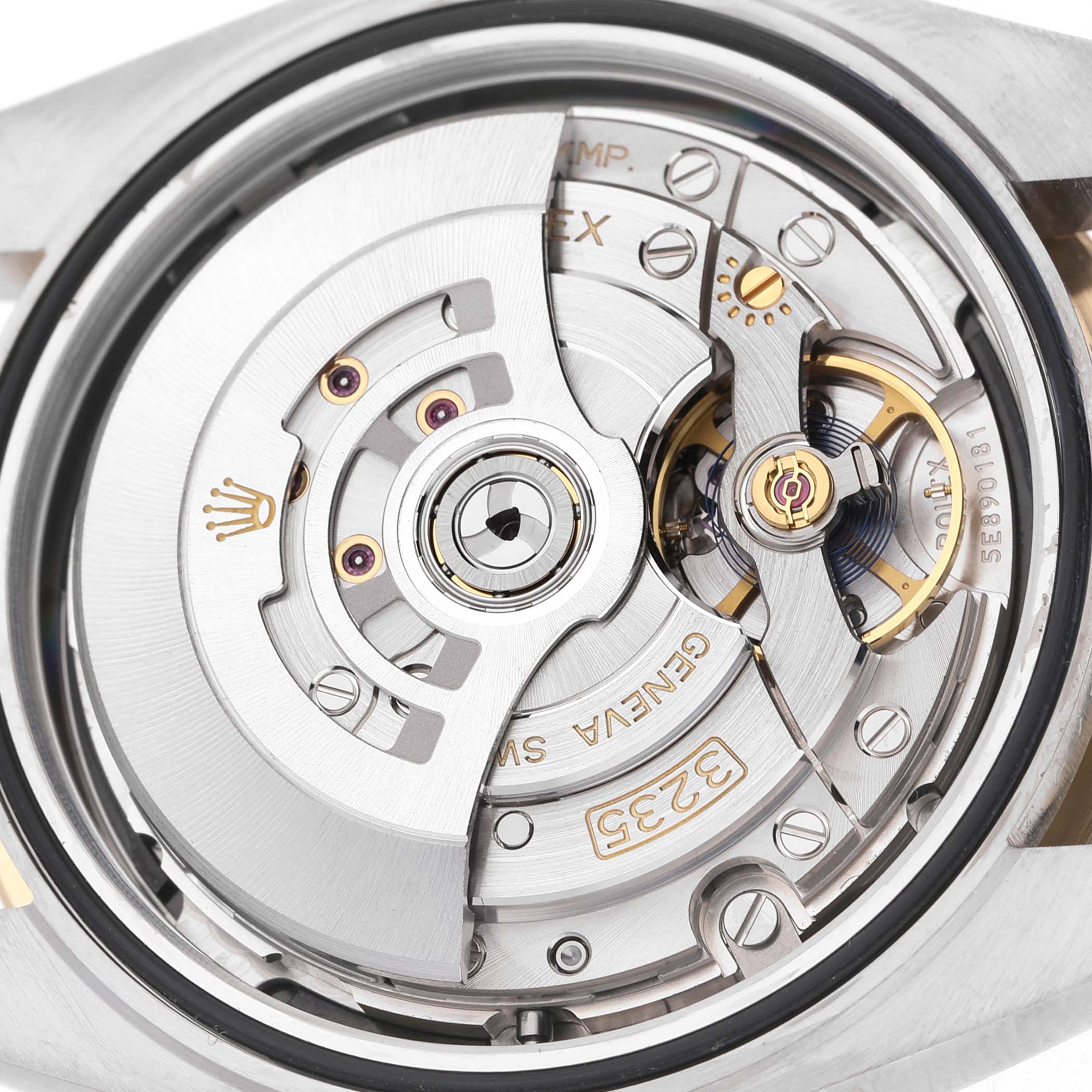 The image shows the Rolex Datejust 41 126333 Men's Steel and Gold (two tone) Black Dial's movement, focusing on the intricate internal mechanisms.