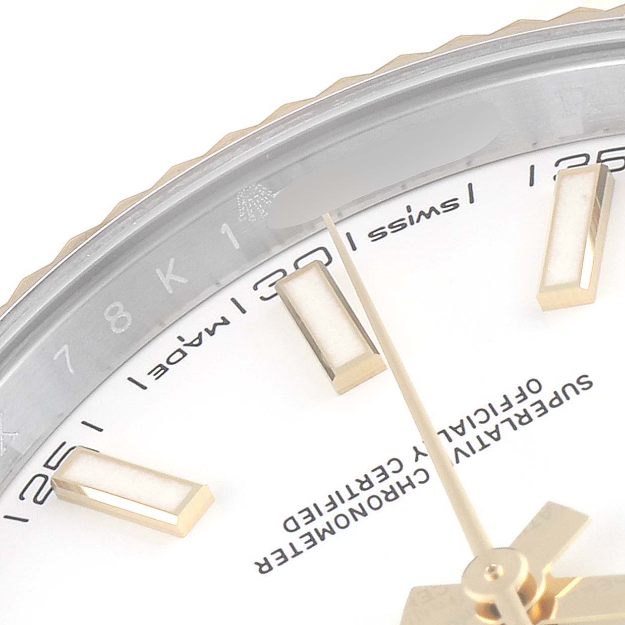 The image shows a close-up of the dial and part of the bezel of a Rolex Datejust 41 126333 Men's Steel and Gold (two tone) White Dial 126333 Men's Steel and Gold (two tone) White Dial watch, focusing on the hour markers and minute hand.
