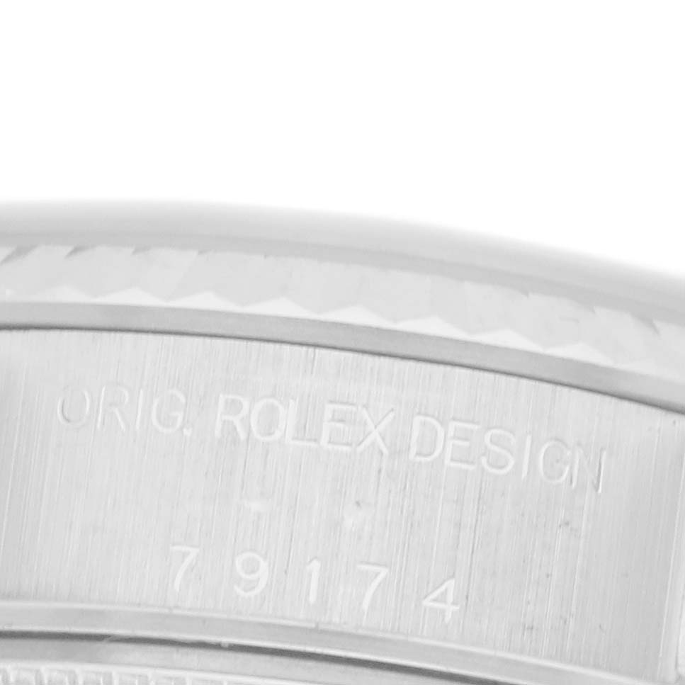 The image shows a close-up of the side of a Rolex Datejust 79174 Women's Stainless Steel Blue Dial 79174 Women's Stainless Steel Blue Dial, highlighting the engraved model details.