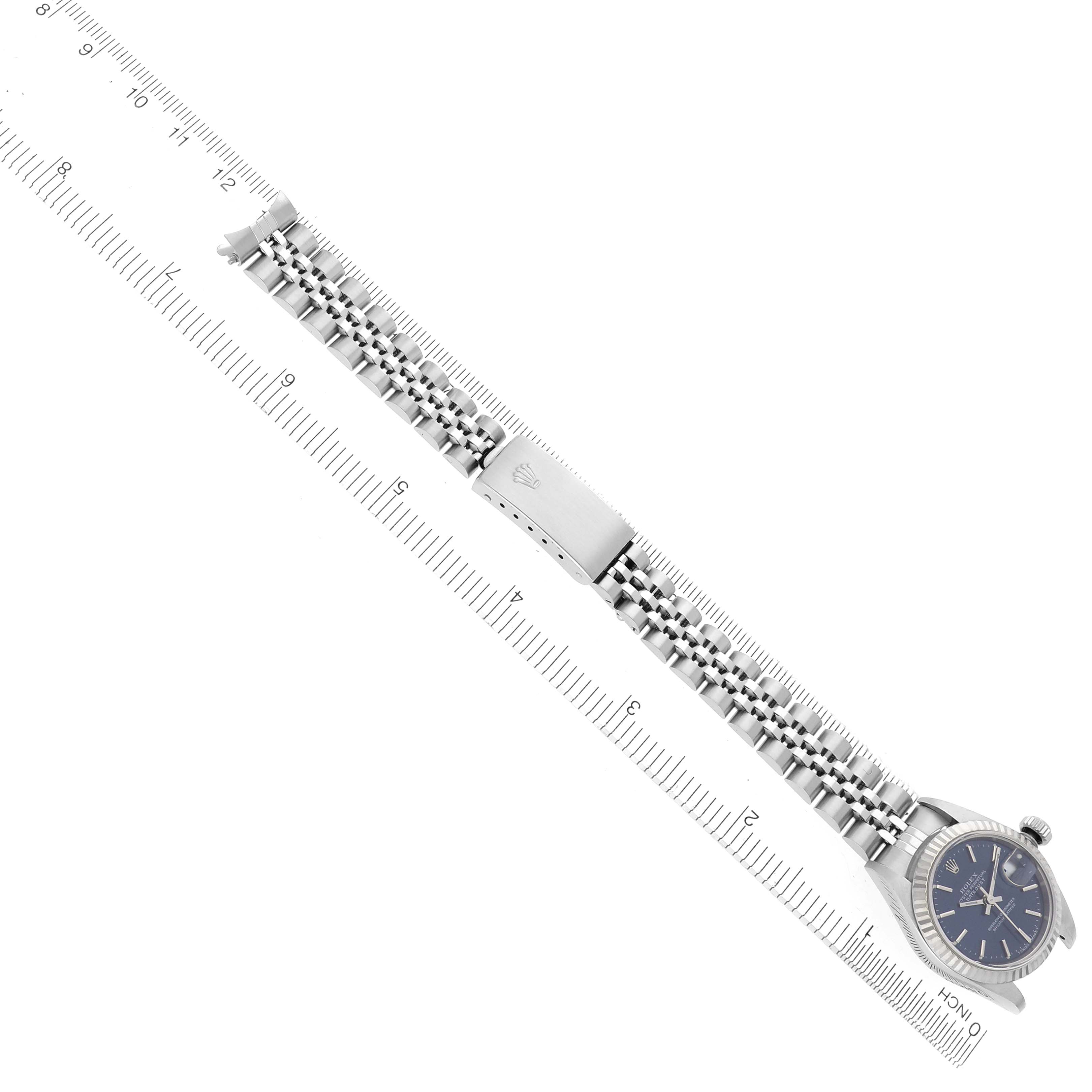The Rolex Datejust 79174 Women's Stainless Steel Blue Dial 79174 Women's Stainless Steel Blue Dial watch is shown from a top angle, highlighting the bracelet with a clasp and part of the watch face.