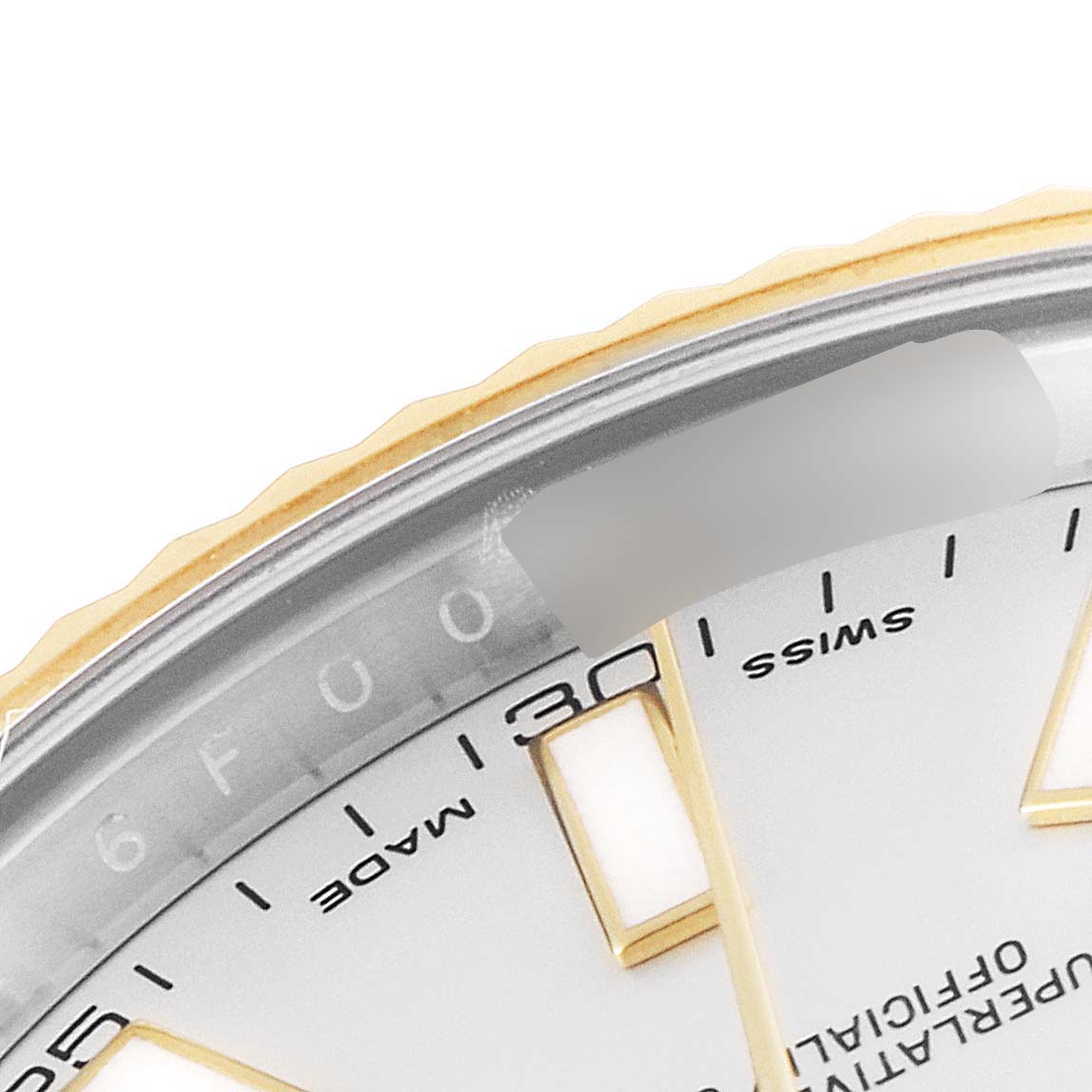 Close-up of a Rolex Datejust 41 116333 Men's Steel and Gold (two tone) Silver Dial 116333 Men's Steel and Gold (two tone) Silver Dial showing the upper right dial segment with numerical markers and part of the bezel.