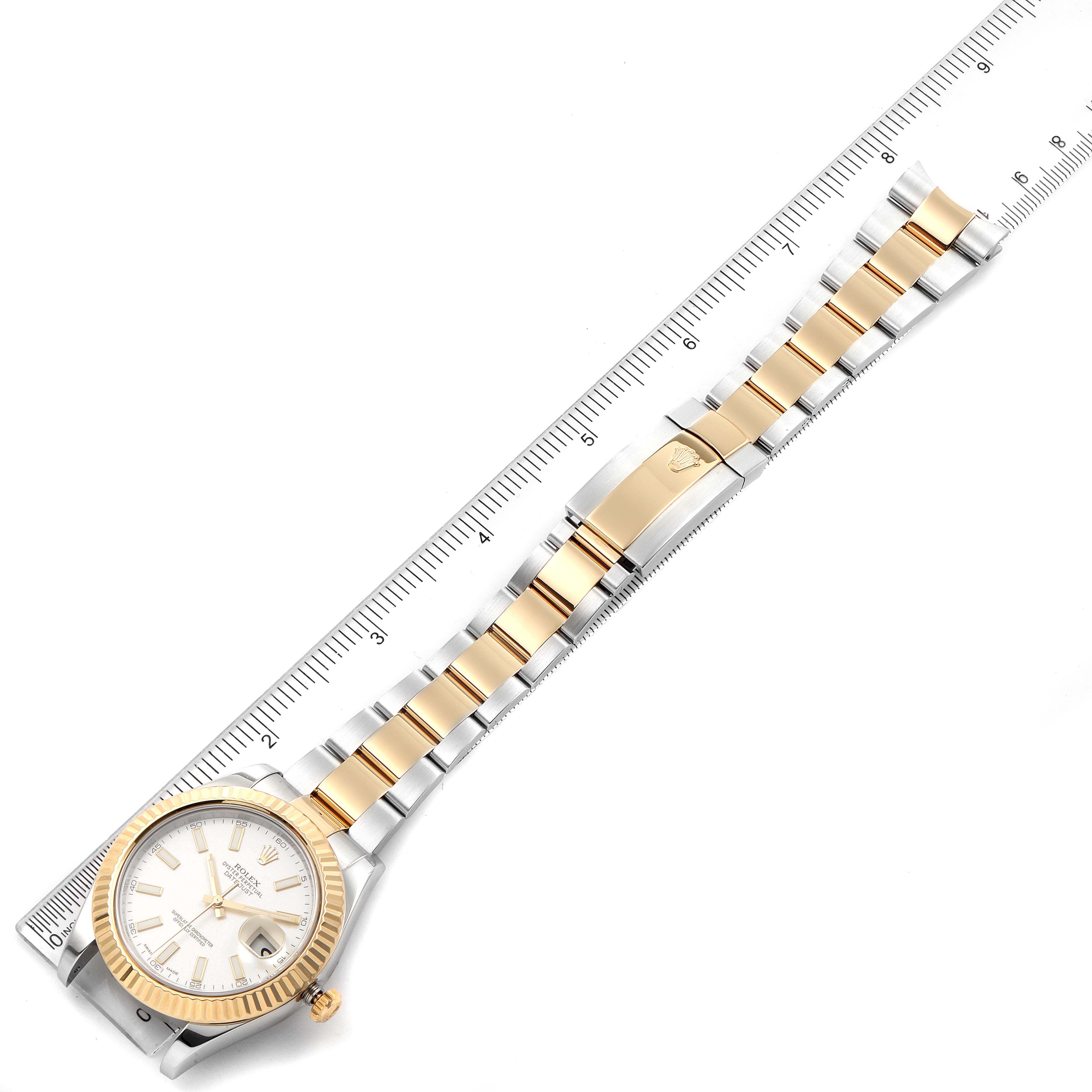 The image shows a top-down view of a Rolex Datejust 41 116333 Men's Steel and Gold (two tone) Silver Dial 116333 Men's Steel and Gold (two tone) Silver Dial watch with a gold and silver bracelet, alongside a measuring ruler.