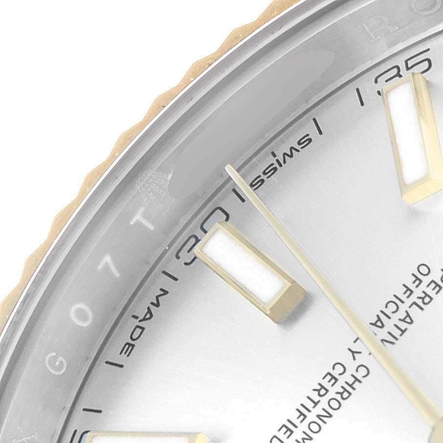 The image shows a close-up of the dial and bezel of a Rolex Datejust 41 126333 Men
s Steel and Gold (two tone) Silver Dial 126333 Men
s Steel and Gold (two tone) Silver Dial watch, highlighting the hour markers and minute hand.