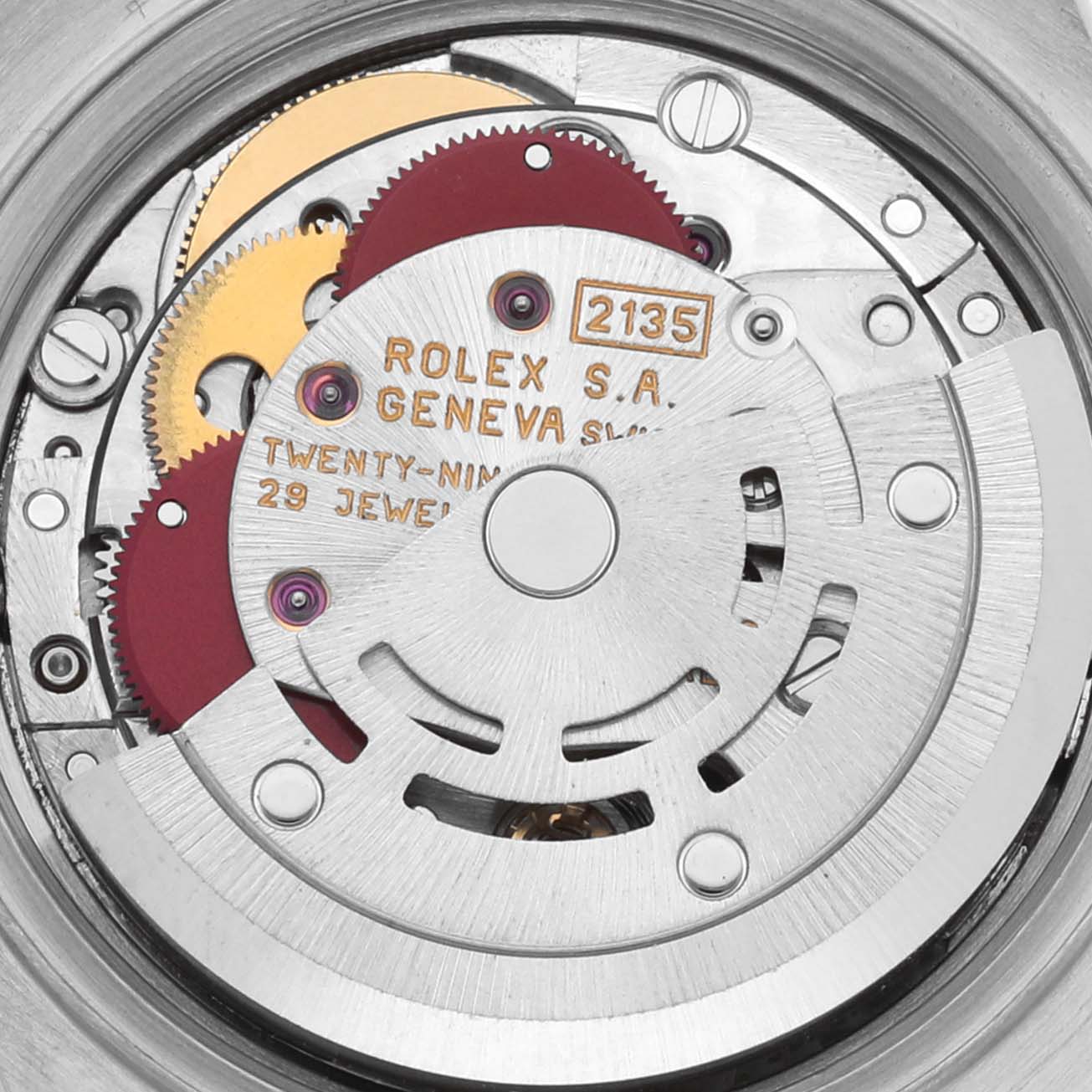 The image shows the intricate movement mechanism of a Rolex Datejust 69173 Women's Steel and Gold (two tone) White Dial 69173 Women's Steel and Gold (two tone) White Dial, highlighting gears and jewel details.