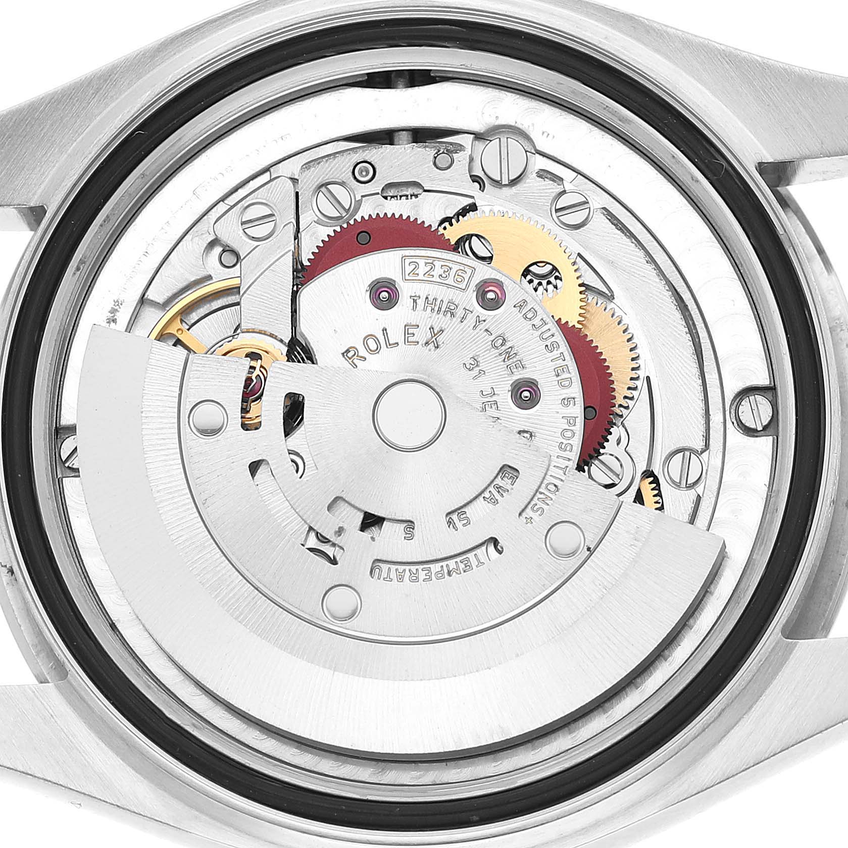 The image shows the movement of a Rolex Datejust 278240 Women's Stainless Steel White Dial watch, highlighting gears and the rotor from a rear angle.