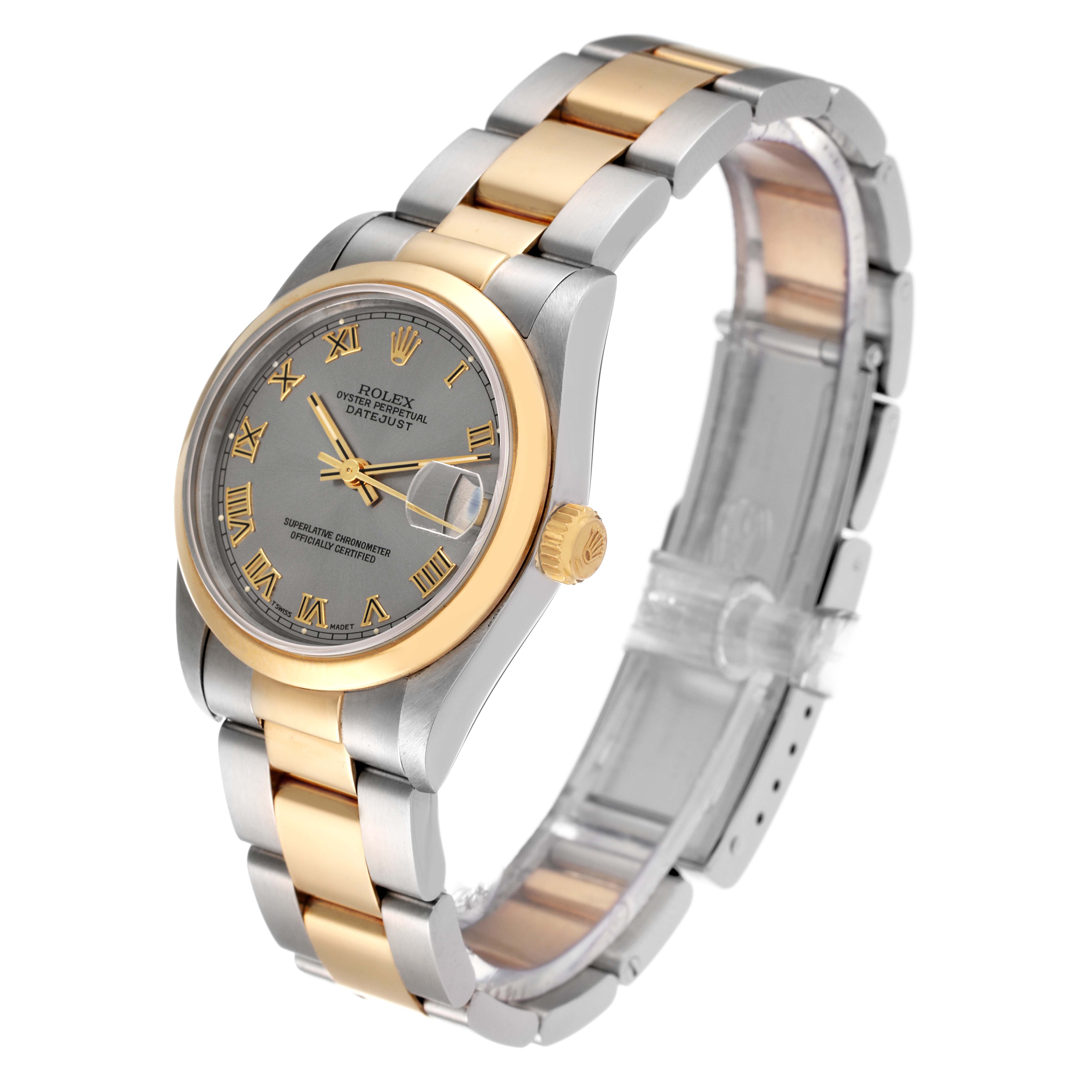 The image shows a Rolex Mid-Size 68243 Women's Steel and Gold (two tone) Silver Dial 68243 Women's Steel and Gold (two tone) Silver Dial Datejust watch from an angled side view, highlighting its two-tone bracelet, gray dial, and gold bezel.