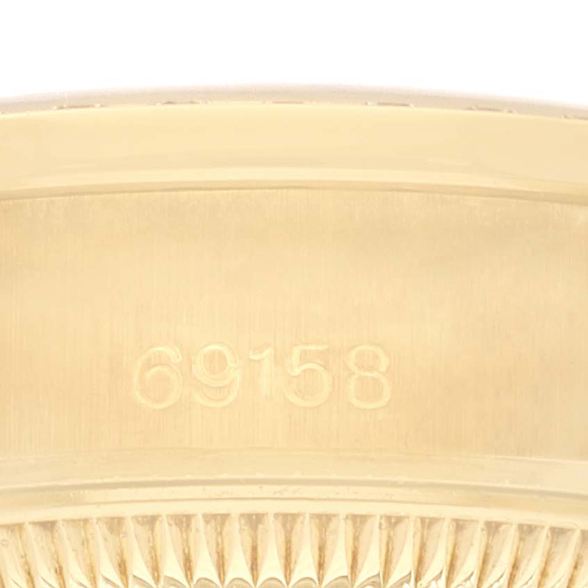 This image shows the inner band of a Rolex President 69158 Women's Yellow Gold Silver Dial 69158 Women's Yellow Gold Silver Dial watch model 69158, viewed from a top angle.