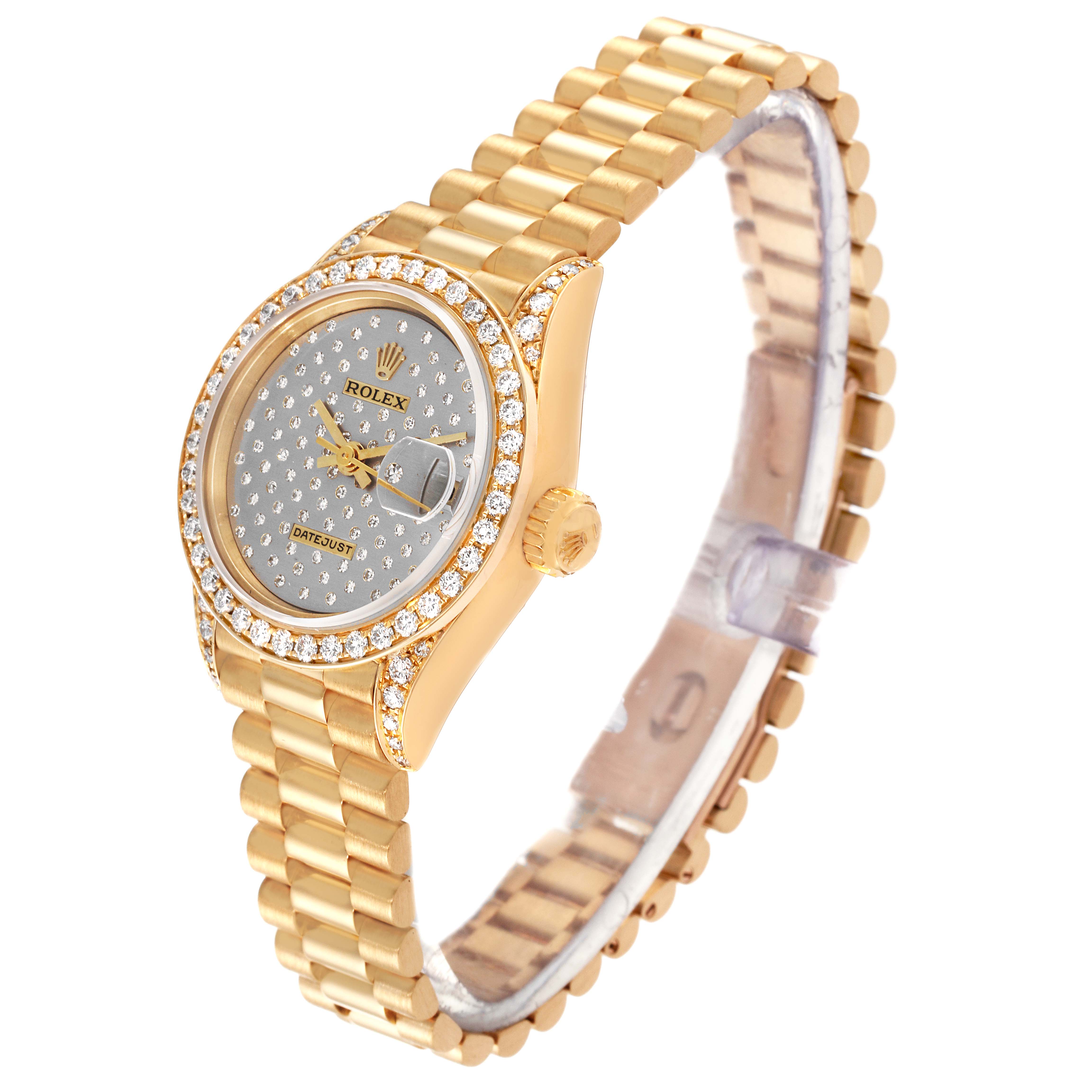The Rolex President 69158 Women's Yellow Gold Silver Dial 69158 Women's Yellow Gold Silver Dial model is shown at an oblique angle, featuring a gold bracelet, diamond bezel, and a textured dial.