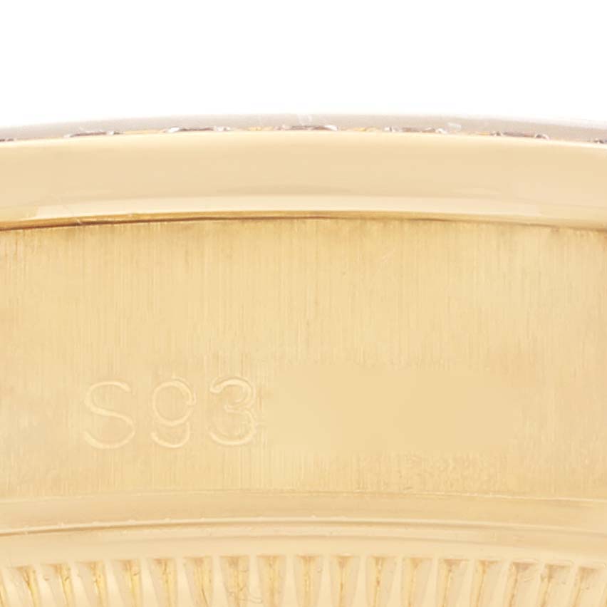 This is a close-up image of the side of a Rolex President 69158 Women's Yellow Gold Silver Dial 69158 Women's Yellow Gold Silver Dial model watch, showing the engraved serial number.