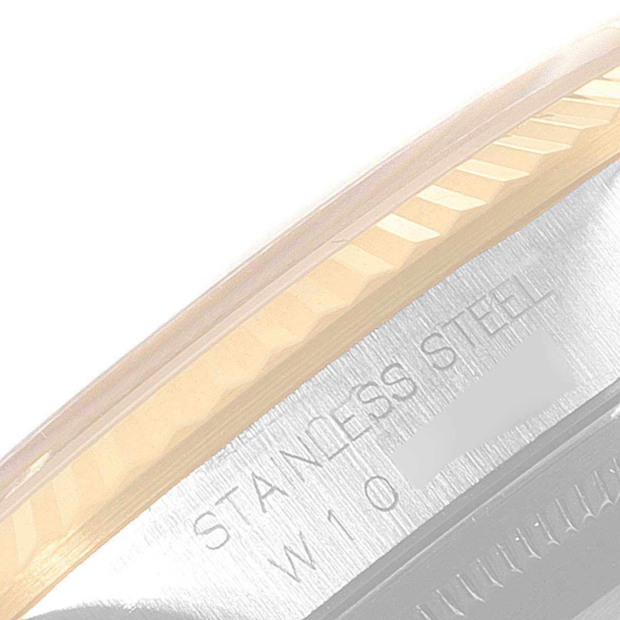 The image shows a close-up of the fluted bezel and part of the stainless steel casing of a Rolex Datejust 16233 Men's Steel and Gold (two tone) Champagne Dial 16233 Men's Steel and Gold (two tone) Champagne Dial watch.
