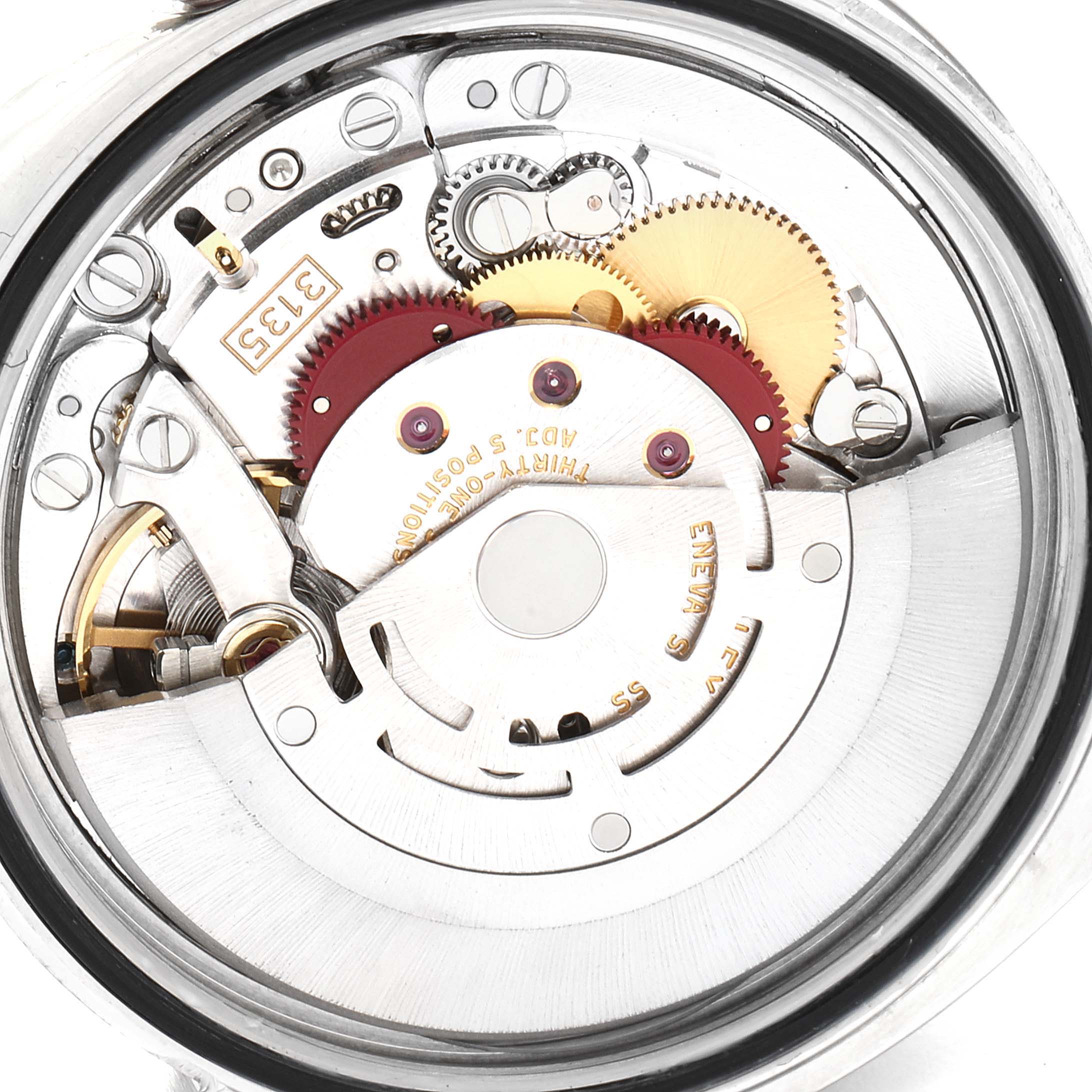 The image shows a close-up view of the movement of a Rolex Datejust 116234 Men's Stainless Steel Black Dial 116234 Men's Stainless Steel Black Dial watch, featuring gears and mechanical components.