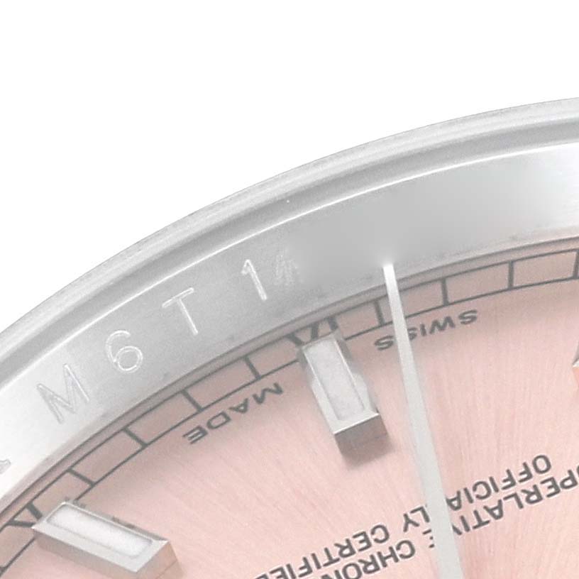 This image shows a close-up of the edge of the dial and bezel of a Rolex Datejust 116234 Men's Stainless Steel Pink Dial 116234 Men's Stainless Steel Pink Dial watch.