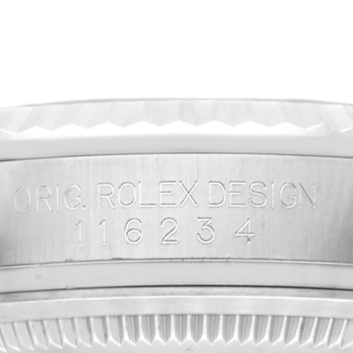 This image shows a close-up of the side of a Rolex Datejust 116234 Men's Stainless Steel Pink Dial 116234 Men's Stainless Steel Pink Dial watch case, focusing on the engraved model number, "116234."