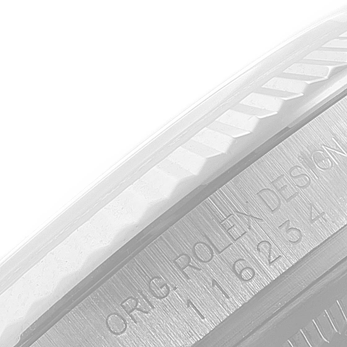 This is a close-up of the case side of a Rolex Datejust 116234 Men's Stainless Steel Silver Dial 116234 Men's Stainless Steel Silver Dial watch, showing the "ORIG. ROLEX DESIGN" engraving.