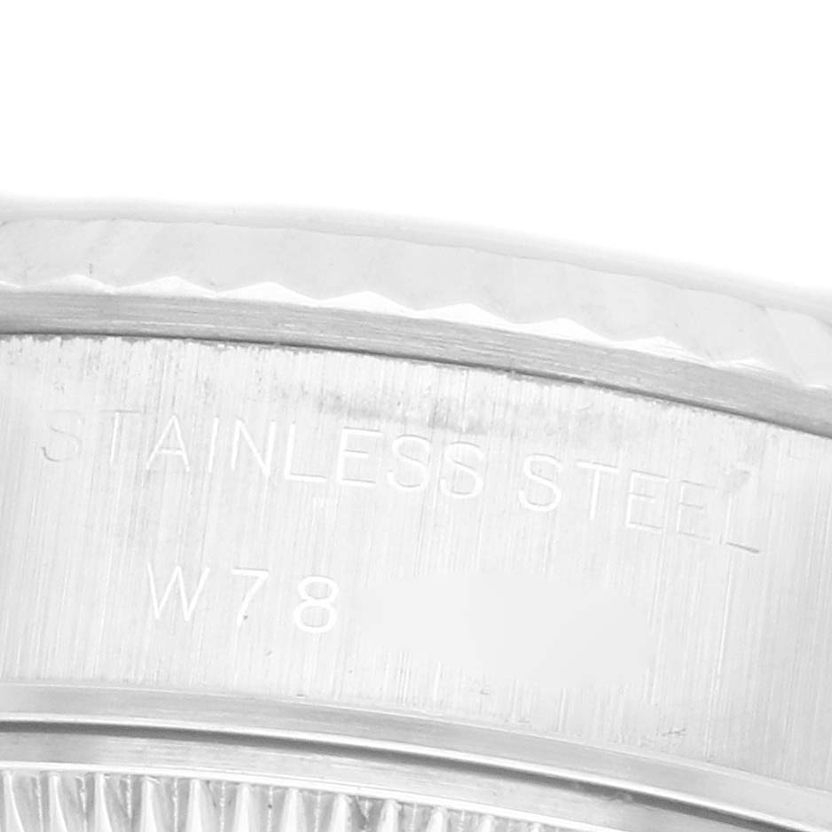 The image shows a close-up of the stainless steel case edge of a Rolex Datejust 69174 Women's Stainless Steel Silver Dial 69174 Women's Stainless Steel Silver Dial watch.