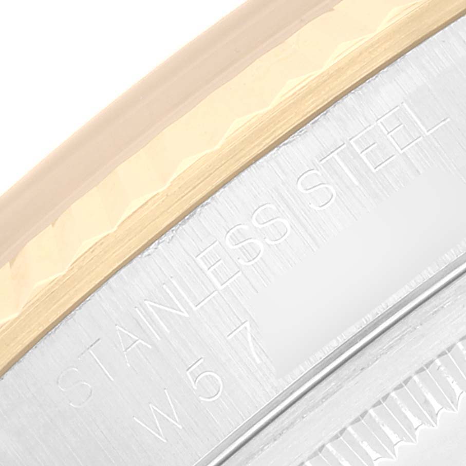 The image shows a close-up of the side of the case and bezel engraving on a Rolex Datejust 16233 Men's Steel and Gold (two tone) Champagne Dial 16233 Men's Steel and Gold (two tone) Champagne Dial watch.