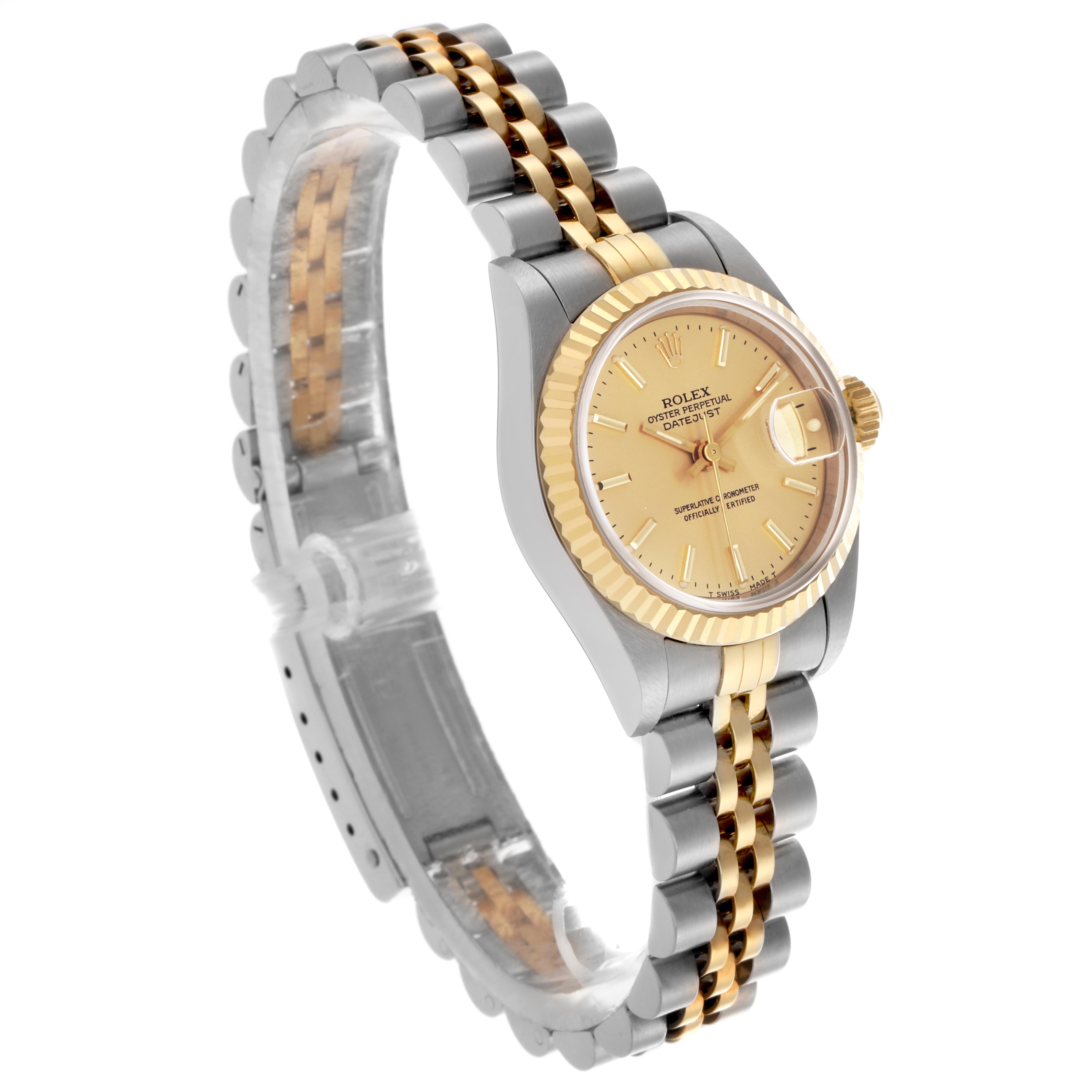 The Rolex Datejust 69173 Women's Steel and Gold (two tone) Champagne Dial 69173 Women's Steel and Gold (two tone) Champagne Dial watch is shown at an angled side view, displaying its dial, bezel, and jubilee bracelet.
