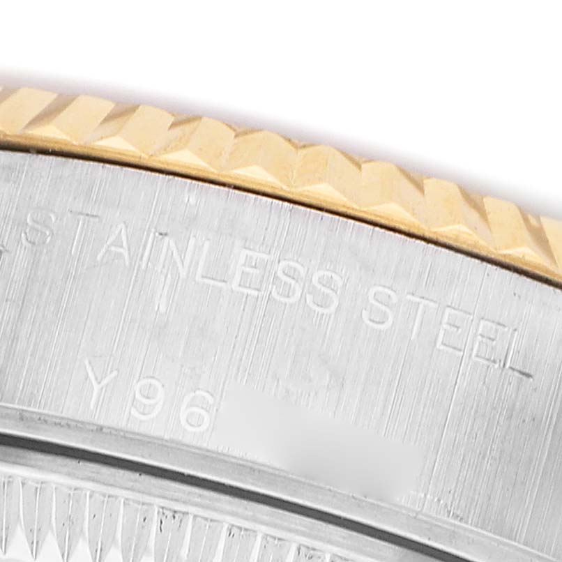 The image shows a close-up of the fluted bezel and case edge of a Rolex Datejust 79173 Women's Steel and Gold (two tone) Champagne Dial watch.