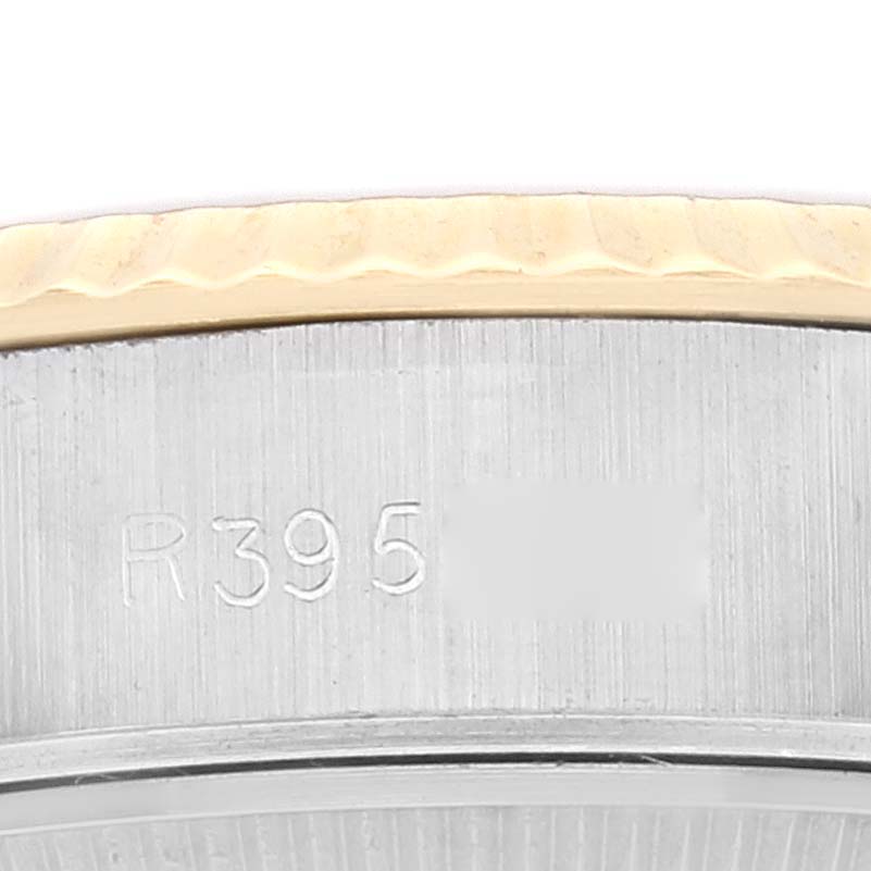 This close-up image shows the edge and serial number area of the Rolex Datejust 69173 Women's Steel and Gold (two tone) Champagne Dial 69173 Women's Steel and Gold (two tone) Champagne Dial watch.