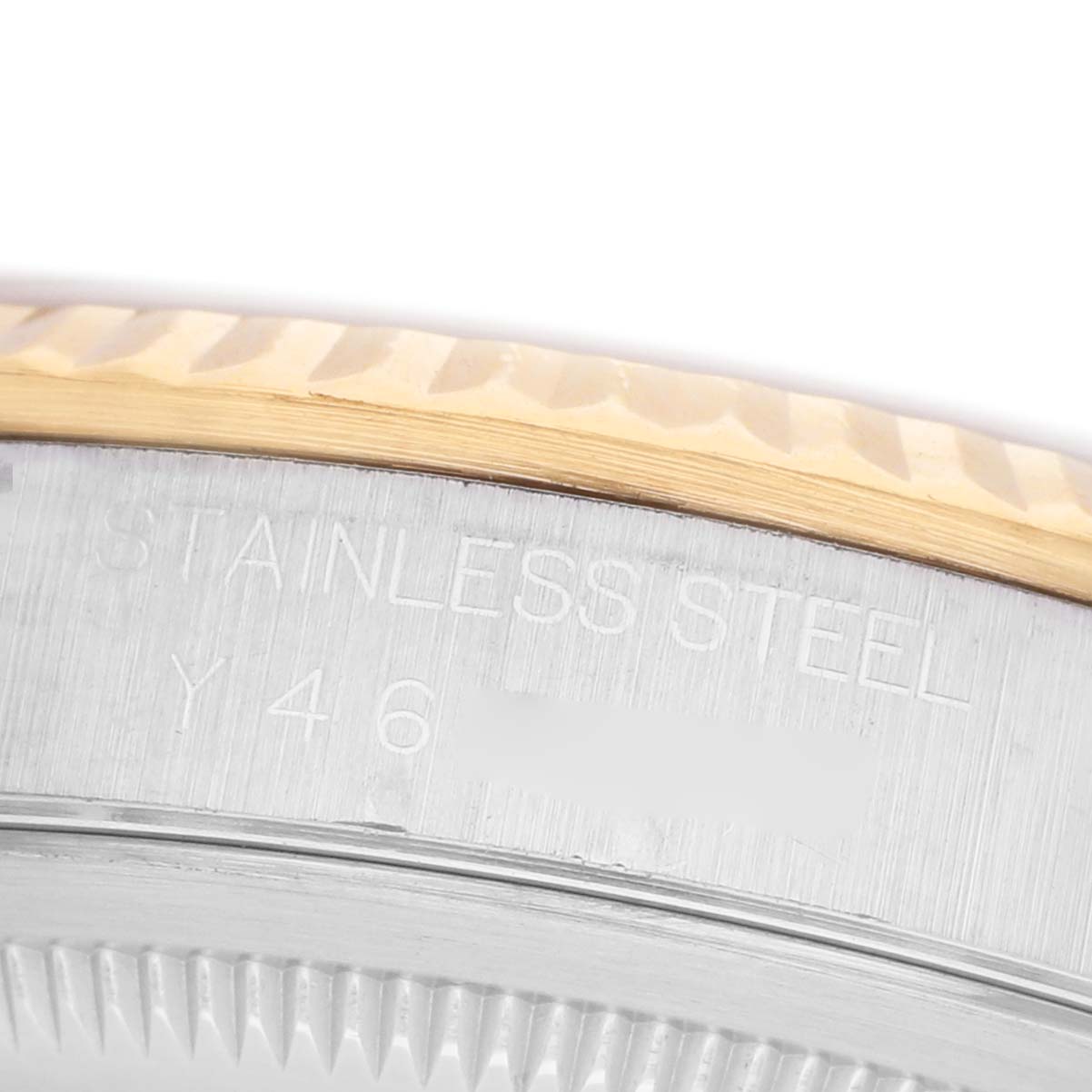 The image shows a close-up of the Rolex Datejust 16233 Men's Steel and Gold (two tone) Champagne Dial watch bezel and case, highlighting the metal texture and engravings.