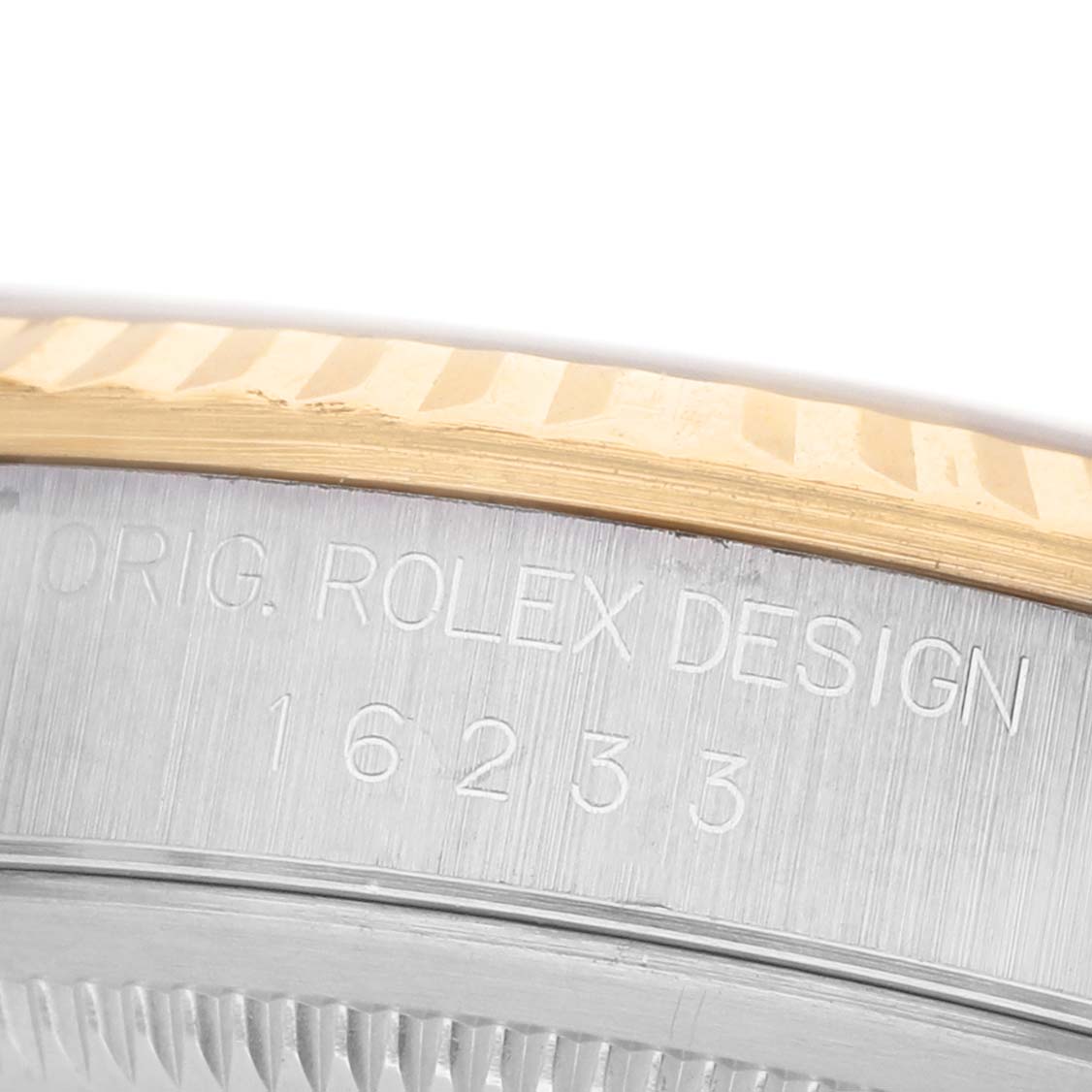 The image shows a close-up of a Rolex Datejust 16233 Men's Steel and Gold (two tone) Champagne Dial's case, highlighting the model number and "Orig. Rolex Design" engraving.