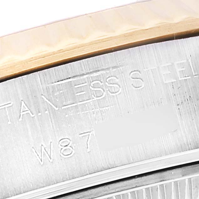 The image shows a close-up of the side of a Rolex Datejust 69173 Women's Steel and Gold (two tone) Champagne Dial 69173 Women's Steel and Gold (two tone) Champagne Dial, focusing on the markings on the stainless steel case.