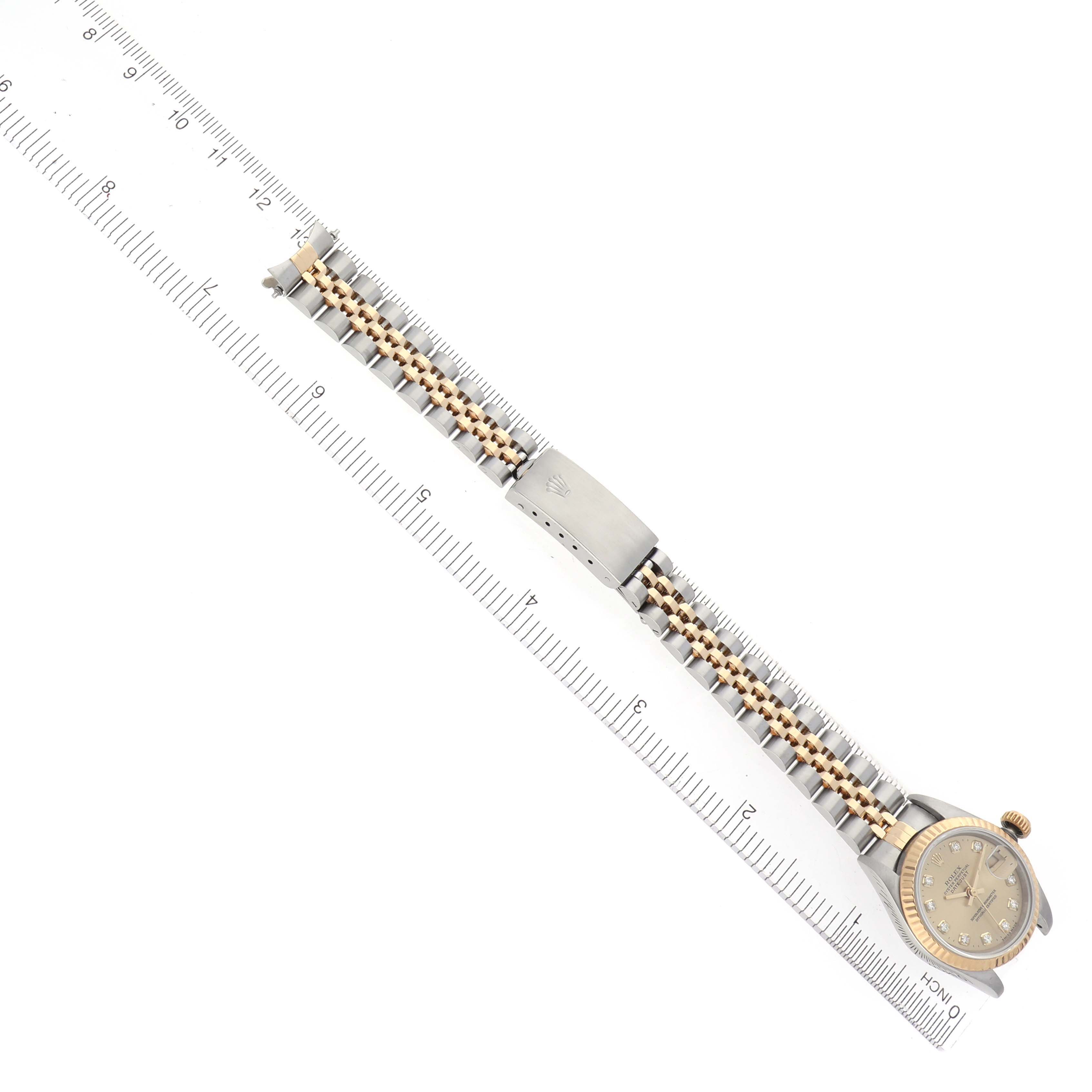The image shows a Rolex Datejust 69173 Women's Steel and Gold (two tone) Champagne Dial 69173 Women's Steel and Gold (two tone) Champagne Dial watch laid flat, highlighting the bracelet and clasp with a ruler for scale.