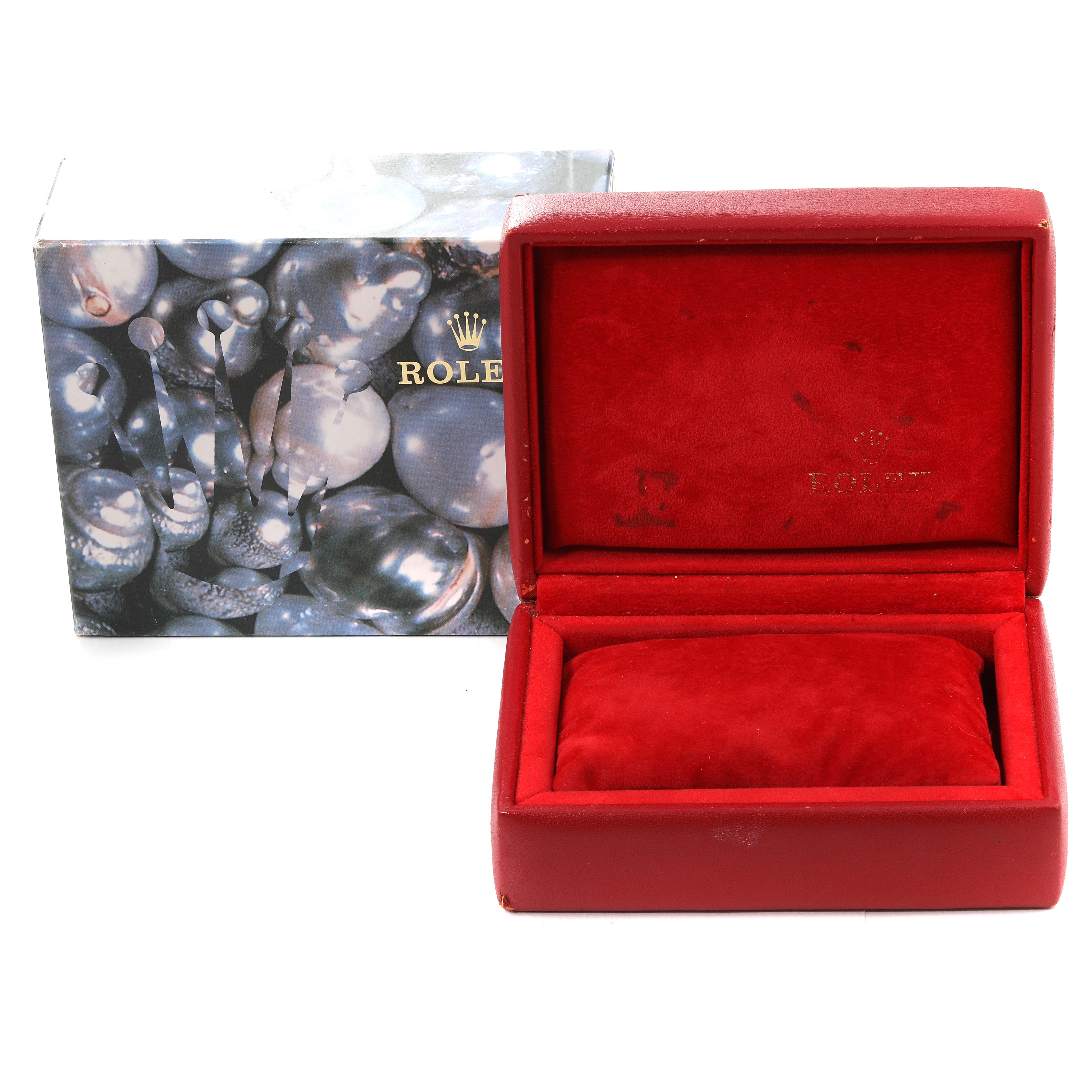 The image shows a red Rolex Datejust 69173 Women's Steel and Gold (two tone) Champagne Dial 69173 Women's Steel and Gold (two tone) Champagne Dial watch box and an outer box with a pearl design and the Rolex logo visible.