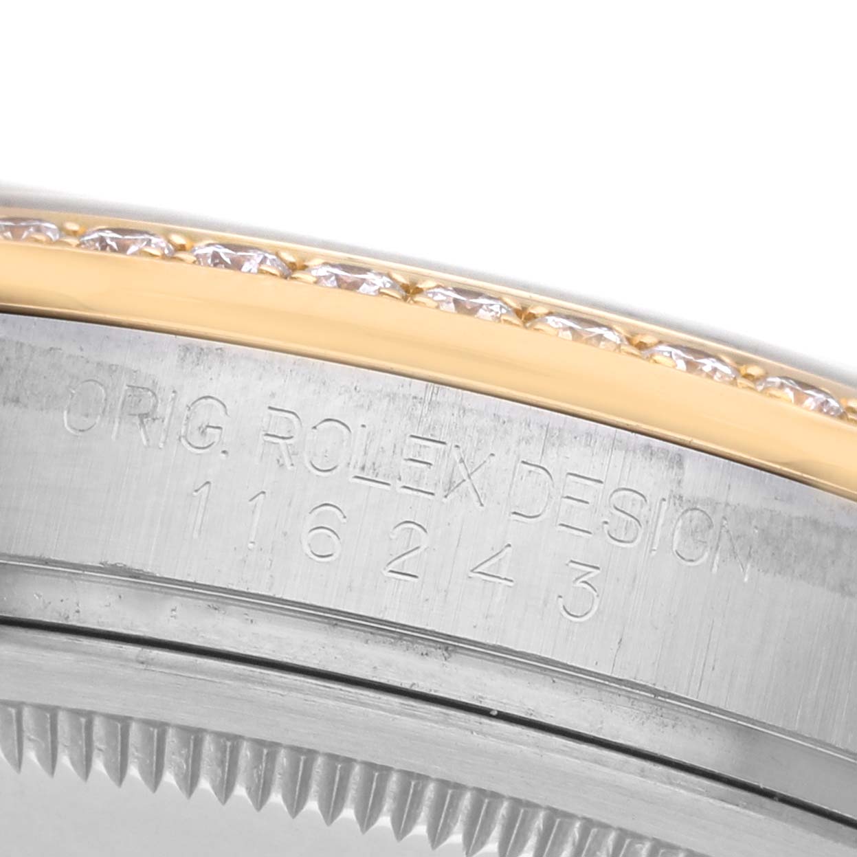 The image shows a close-up of the edge and bezel of a Rolex Datejust 116243 Men's Steel and Gold (two tone) Mother of Pearl Dial, highlighting model engraving and diamond accents.
