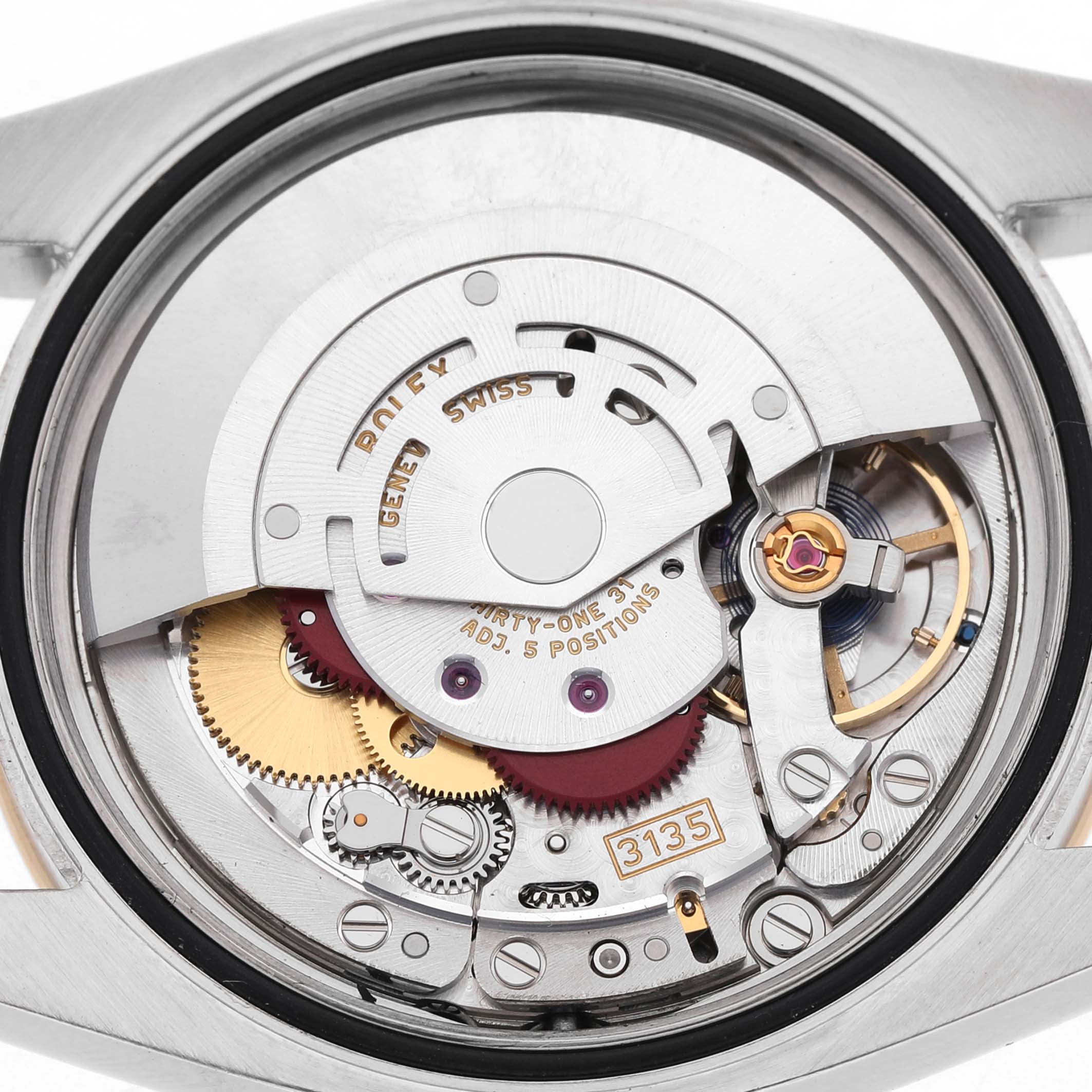 The image shows the movement and rotor of a Rolex Datejust 116243 Men's Steel and Gold (two tone) Mother of Pearl Dial from a back angle.