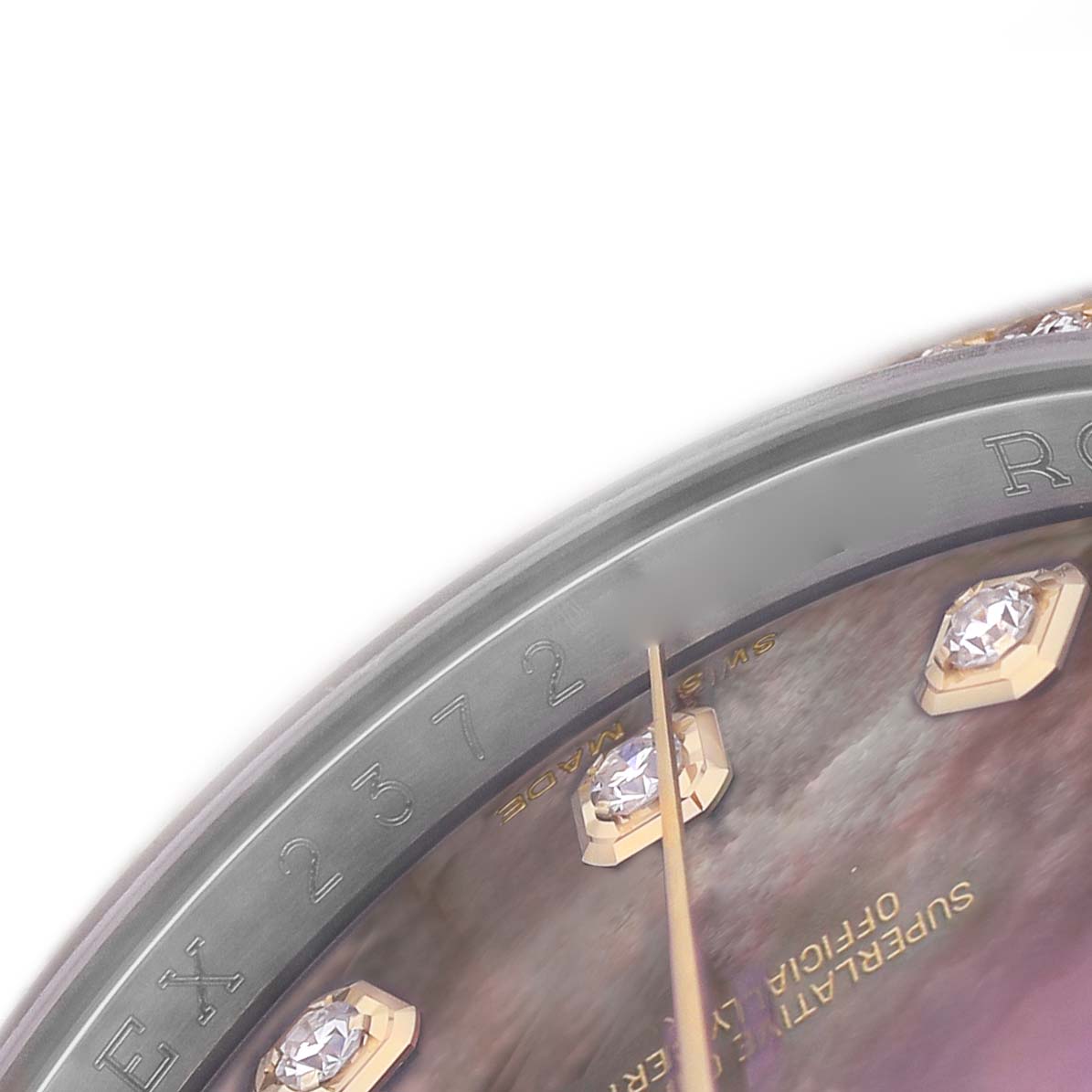 The image shows a close-up of the Rolex Datejust 116243 Men's Steel and Gold (two tone) Mother of Pearl Dial dial, focusing on the bezel, hour markers, and part of the text.