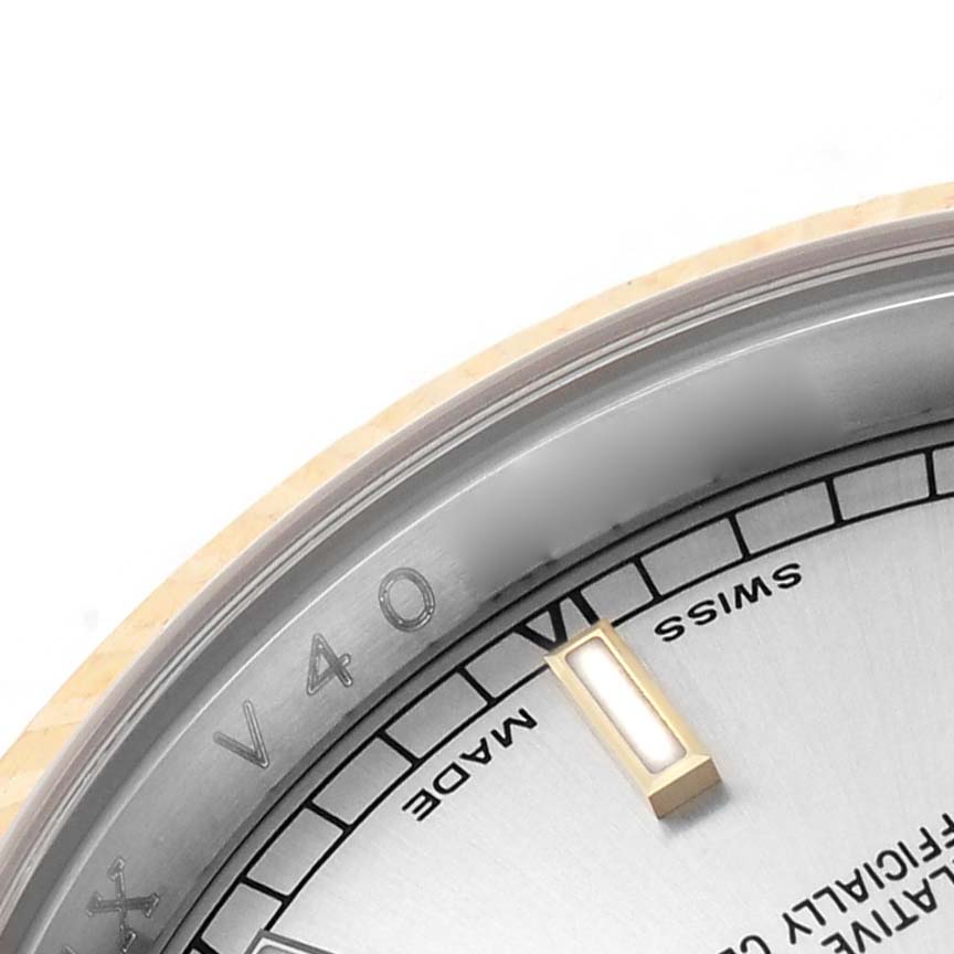 This image shows a close-up of the dial and bezel of a Rolex Datejust 116233 Men's Stainless Steel Silver Dial, focusing on the hour marker and inscriptions.