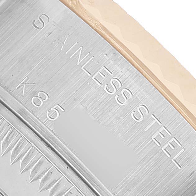 The image shows a close-up of the side of a Rolex Datejust 79173 Women's Steel and Gold (two tone) Silver Dial watch, highlighting the engraved "STAINLESS STEEL" text.