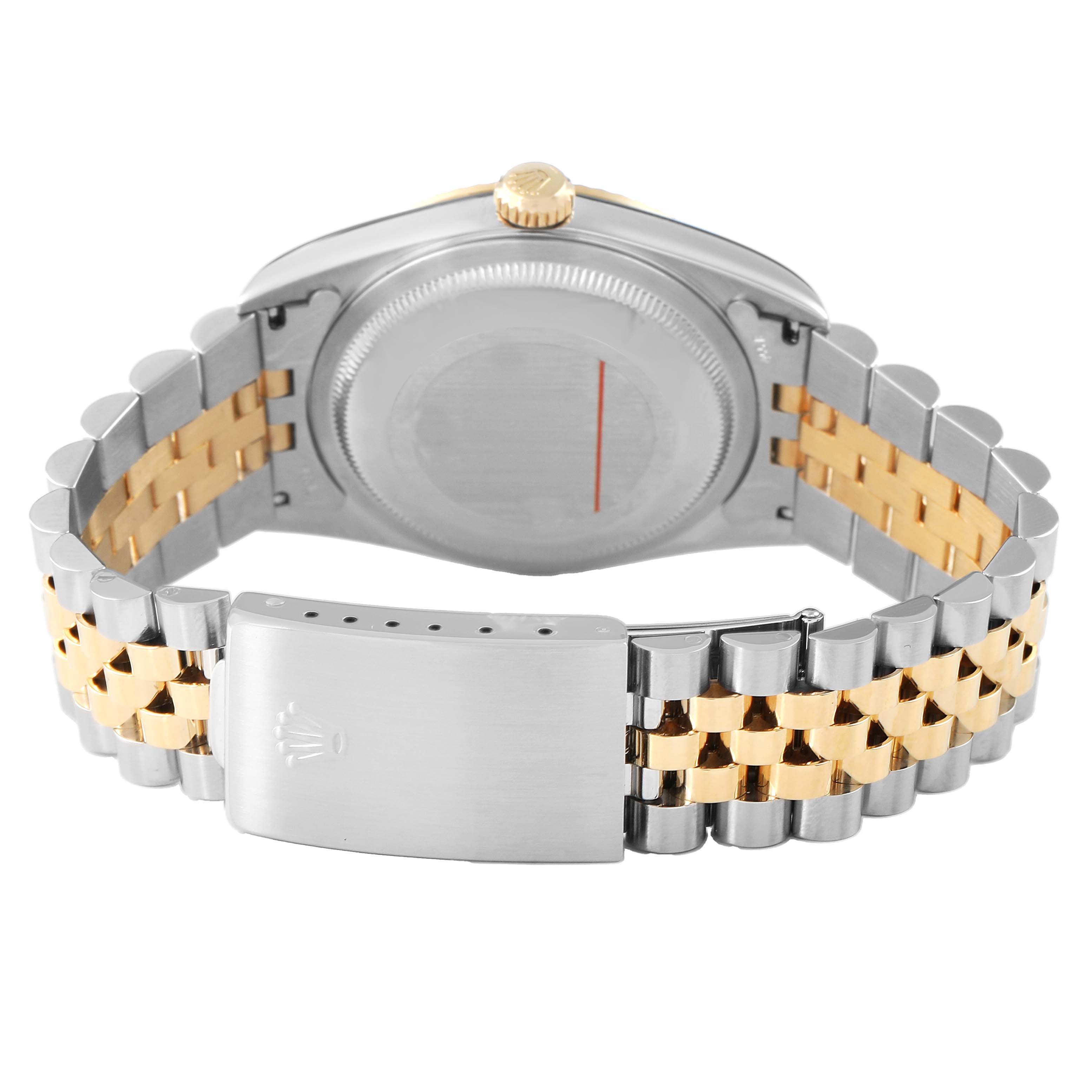 The Rolex Datejust 16233 Men's Steel and Gold (two tone) Silver Dial watch is shown from the back, highlighting the case back, gold crown, and two-tone bracelet with the clasp.