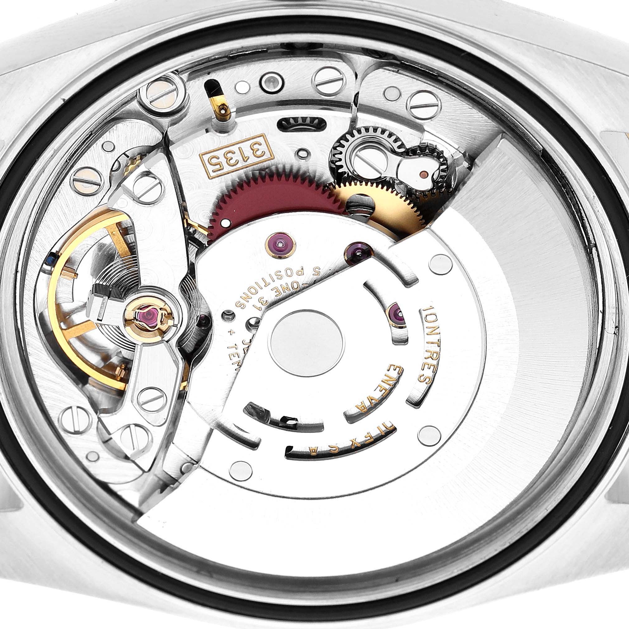 The image shows the internal mechanism of a Rolex Datejust 16233 Men's Steel and Gold (two tone) Silver Dial watch from a back angle, highlighting gears and balance wheel components.