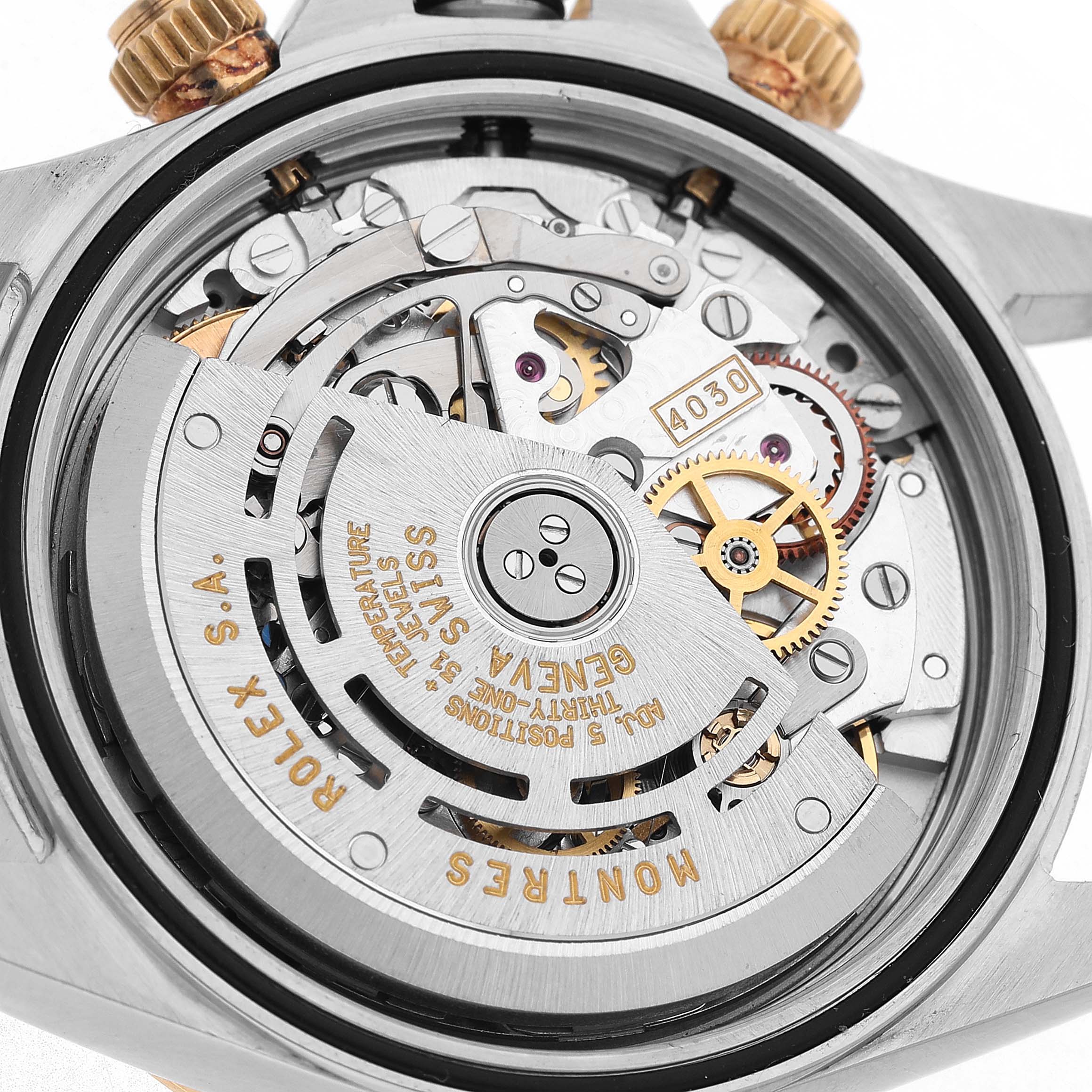 The image shows the back view of a Rolex Daytona 16523 Men's Steel and Gold (two tone) White Dial, highlighting the intricate movement and rotor parts.