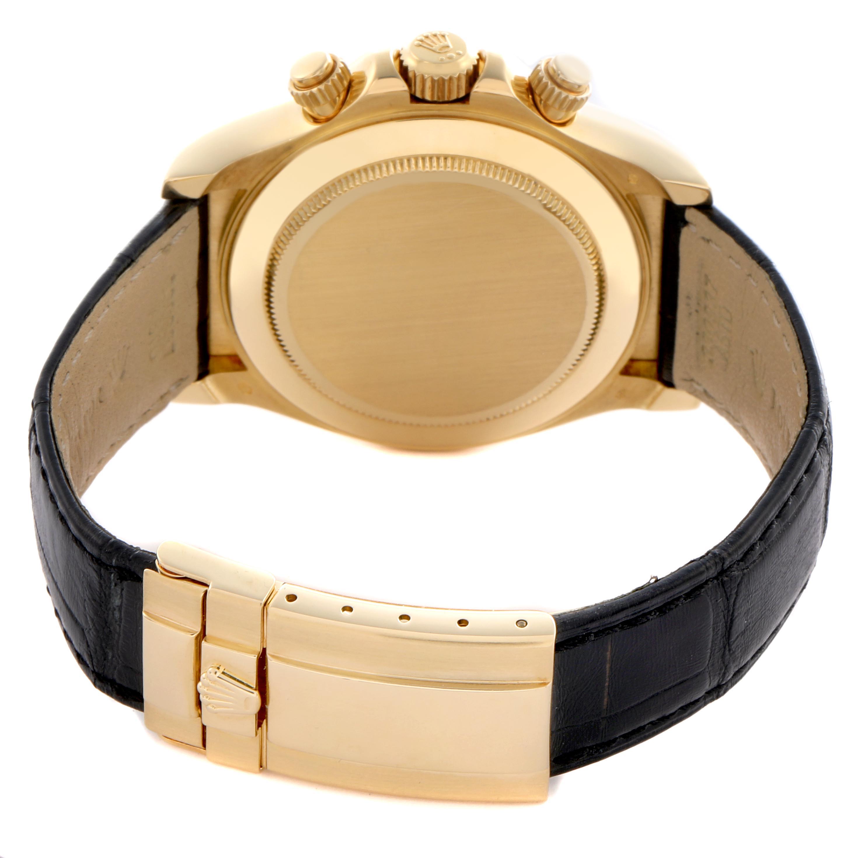 The Rolex Daytona 116518 Men's Yellow Gold Black Dial 116518 Men's Yellow Gold Black Dial watch is shown from the back, displaying the case back, black leather strap, and gold clasp.