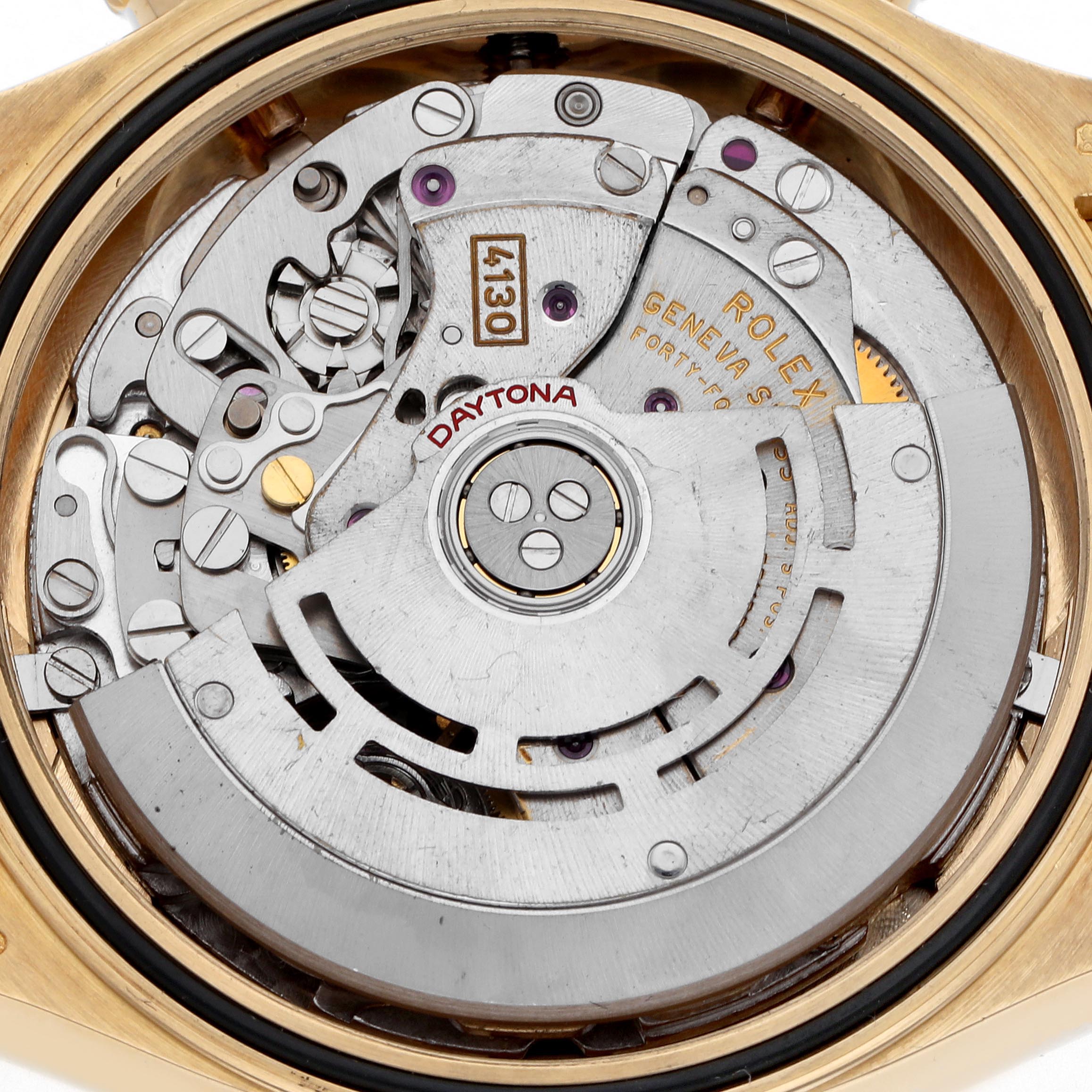 The image shows the movement of a Rolex Daytona 116518 Men's Yellow Gold Black Dial 116518 Men's Yellow Gold Black Dial watch from a rear view, highlighting the intricate mechanisms.